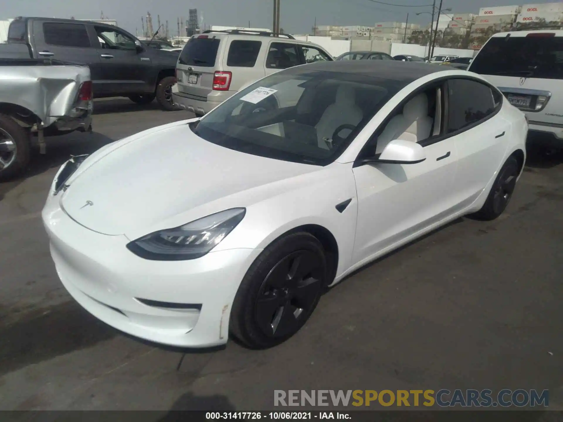 2 Photograph of a damaged car 5YJ3E1EA6MF857405 TESLA MODEL 3 2021