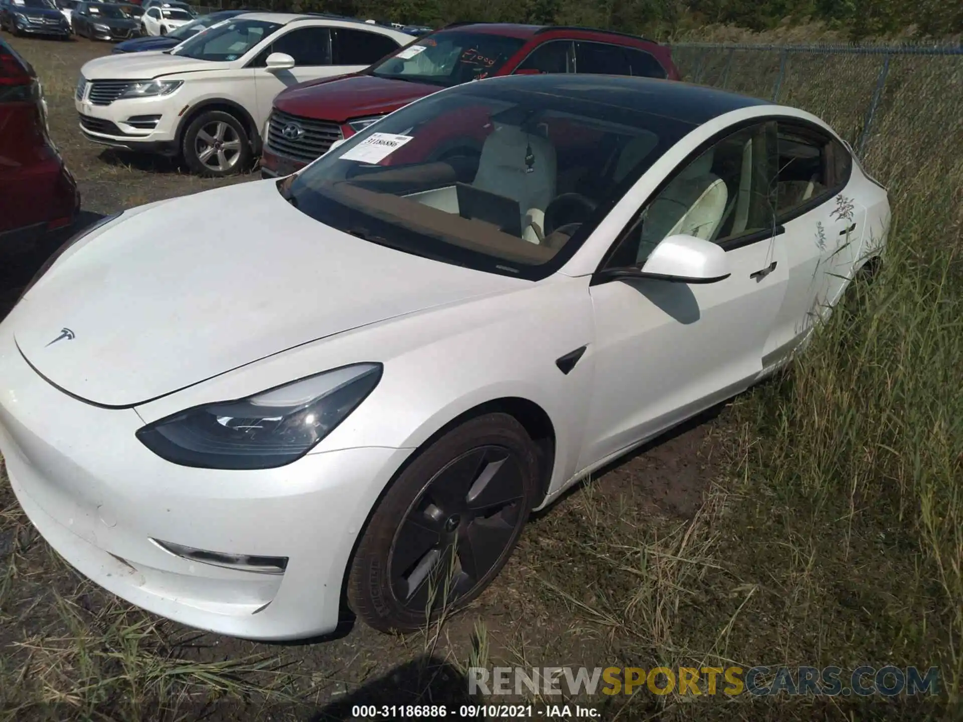 2 Photograph of a damaged car 5YJ3E1EA7MF908605 TESLA MODEL 3 2021