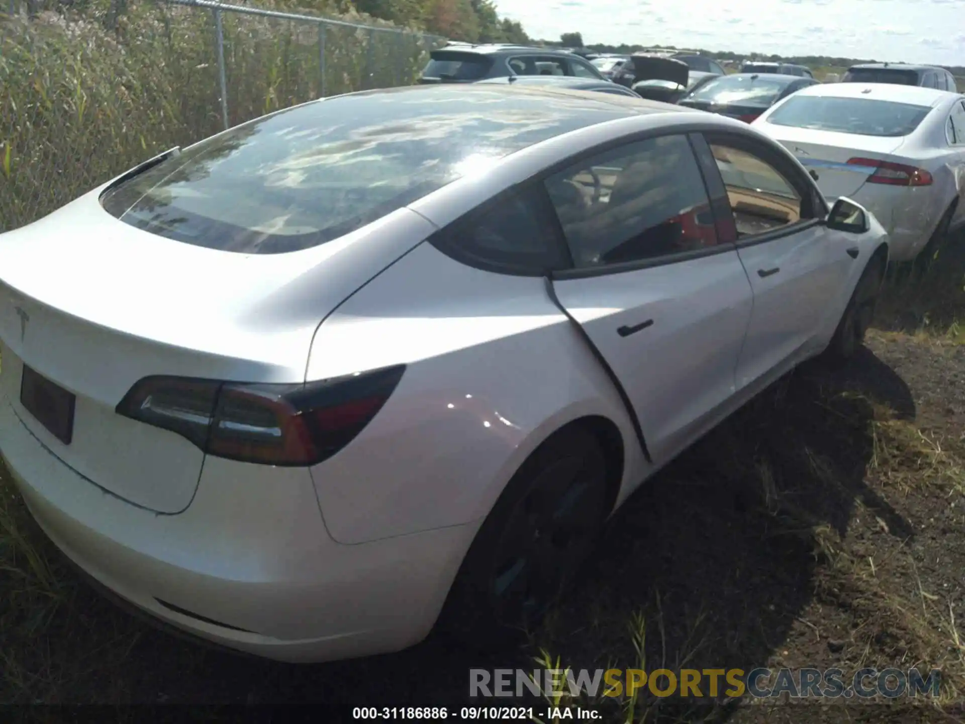 4 Photograph of a damaged car 5YJ3E1EA7MF908605 TESLA MODEL 3 2021