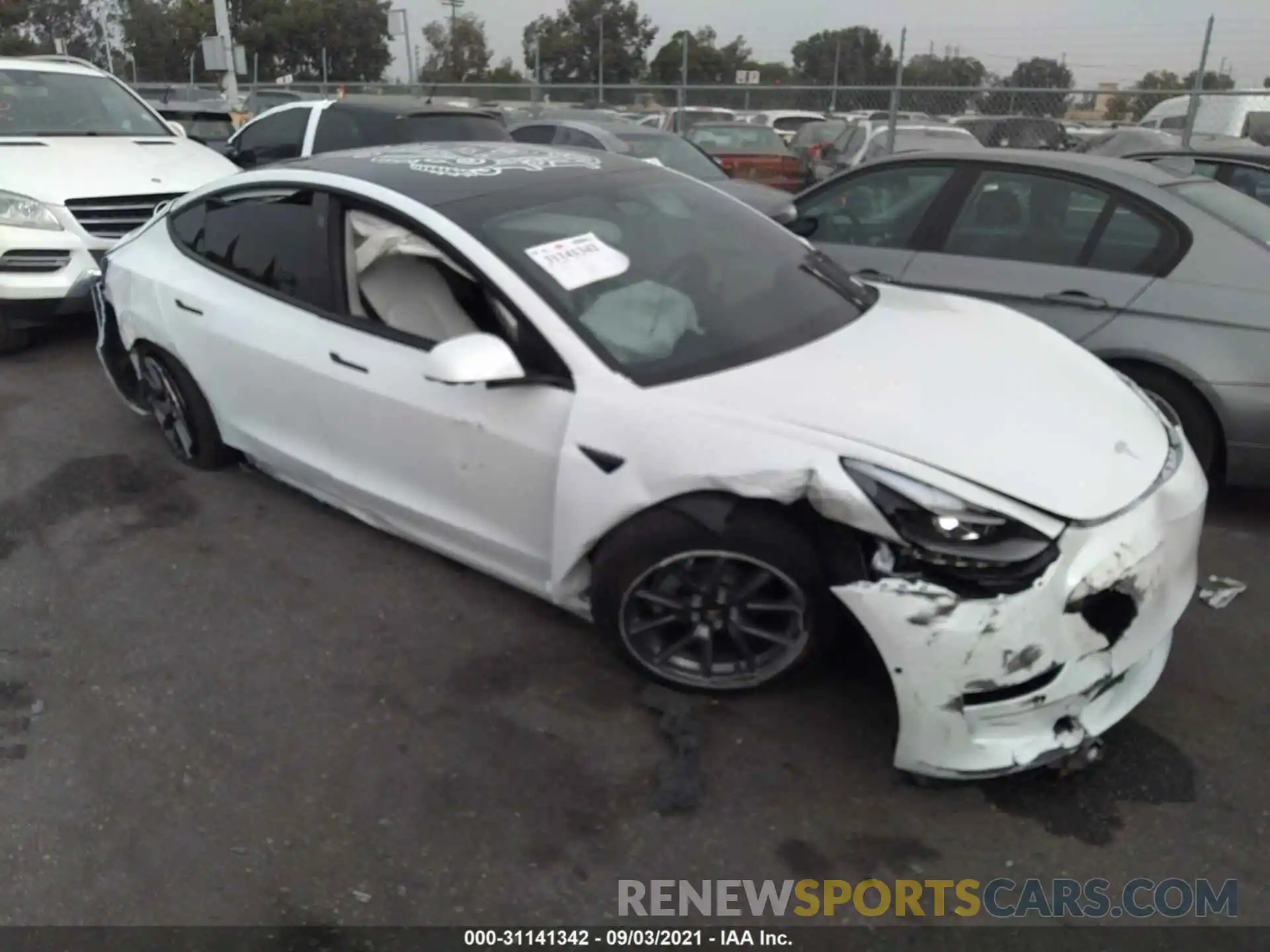 1 Photograph of a damaged car 5YJ3E1EA8MF928863 TESLA MODEL 3 2021