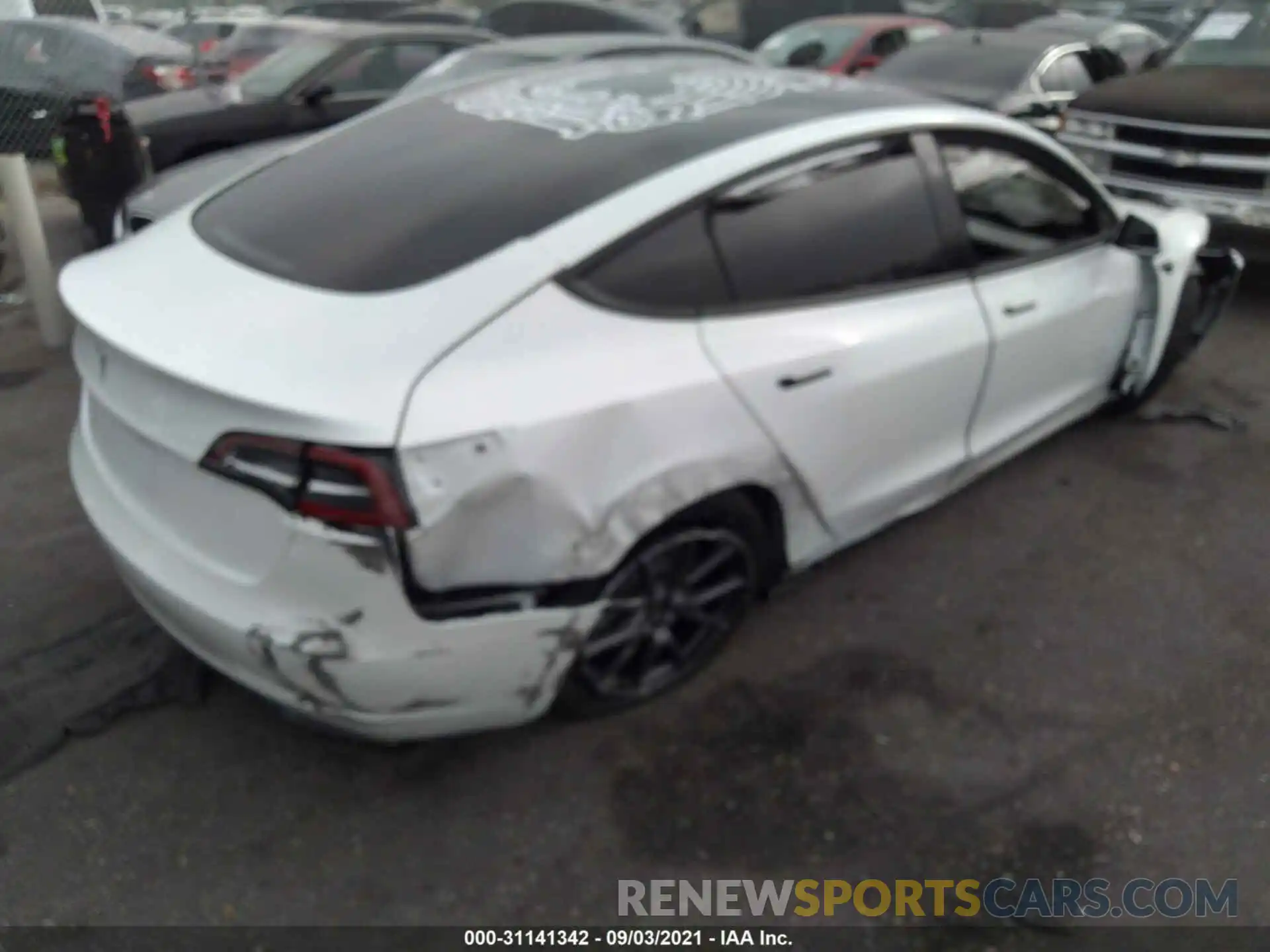 4 Photograph of a damaged car 5YJ3E1EA8MF928863 TESLA MODEL 3 2021