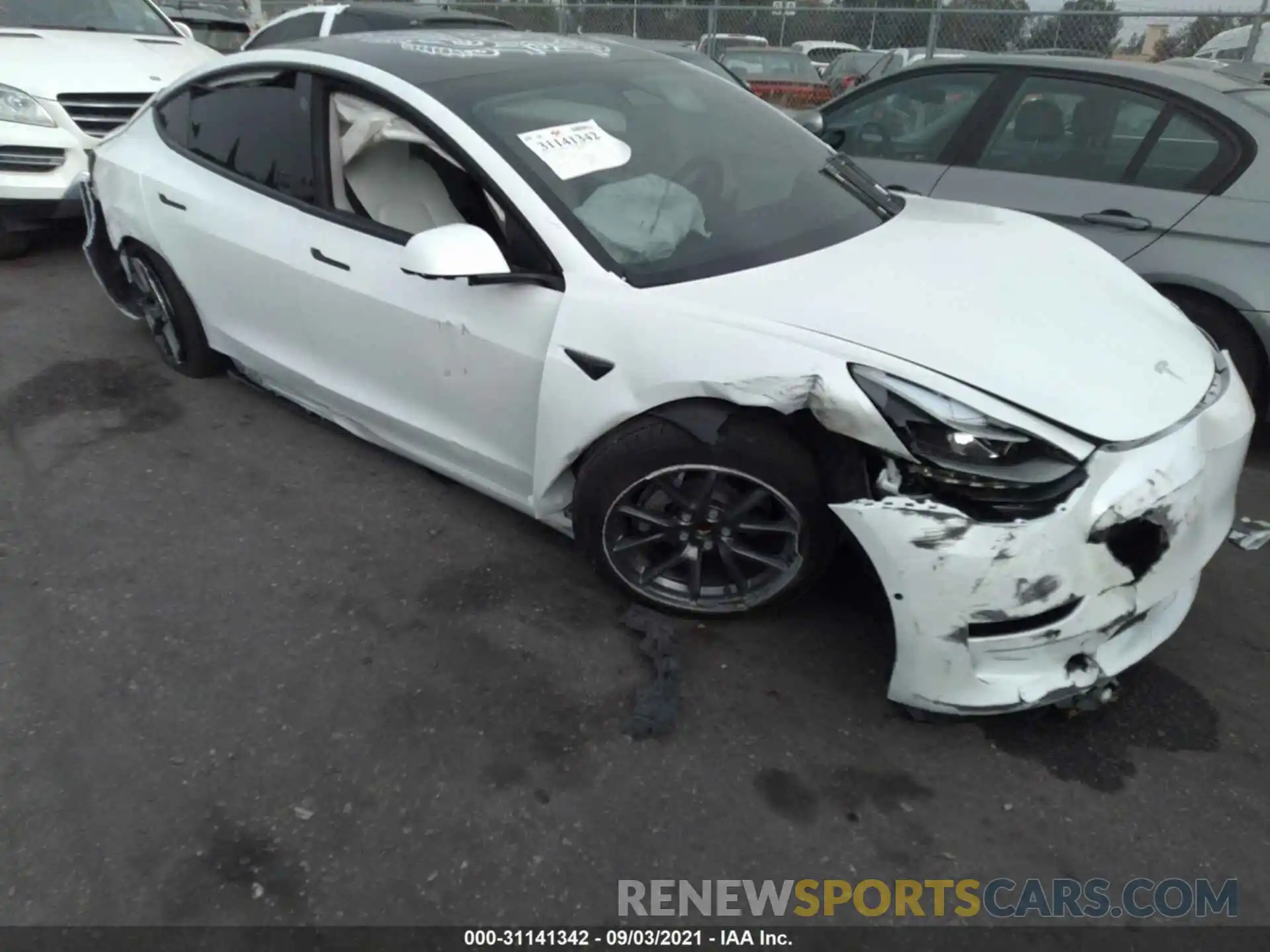 6 Photograph of a damaged car 5YJ3E1EA8MF928863 TESLA MODEL 3 2021