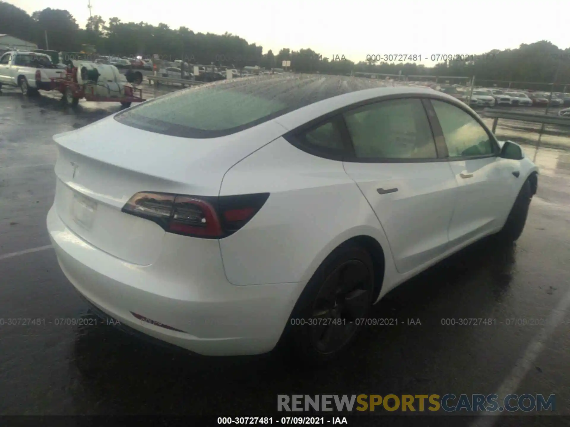 4 Photograph of a damaged car 5YJ3E1EA9MF915815 TESLA MODEL 3 2021