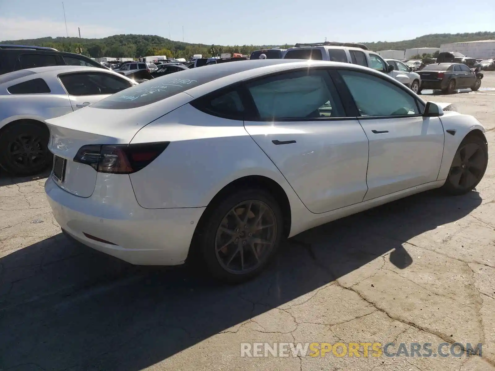 4 Photograph of a damaged car 5YJ3E1EAXMF919792 TESLA MODEL 3 2021