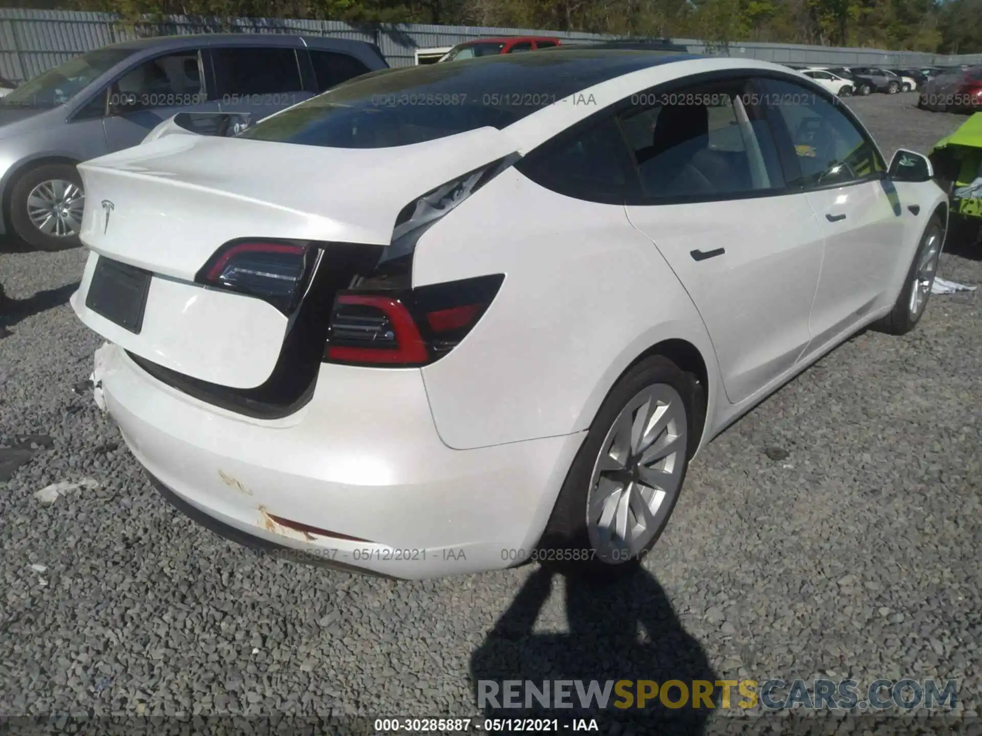 4 Photograph of a damaged car 5YJ3E1EAXMF921994 TESLA MODEL 3 2021