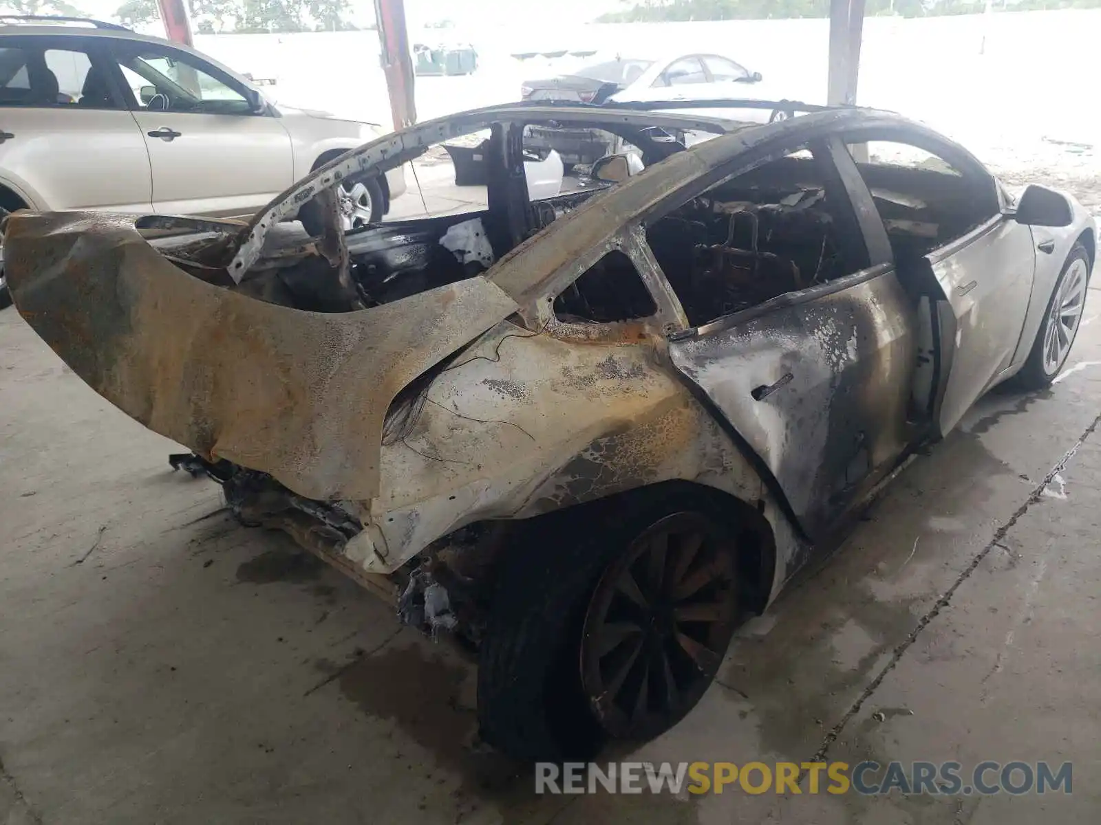 4 Photograph of a damaged car 5YJ3E1EAXMF978583 TESLA MODEL 3 2021