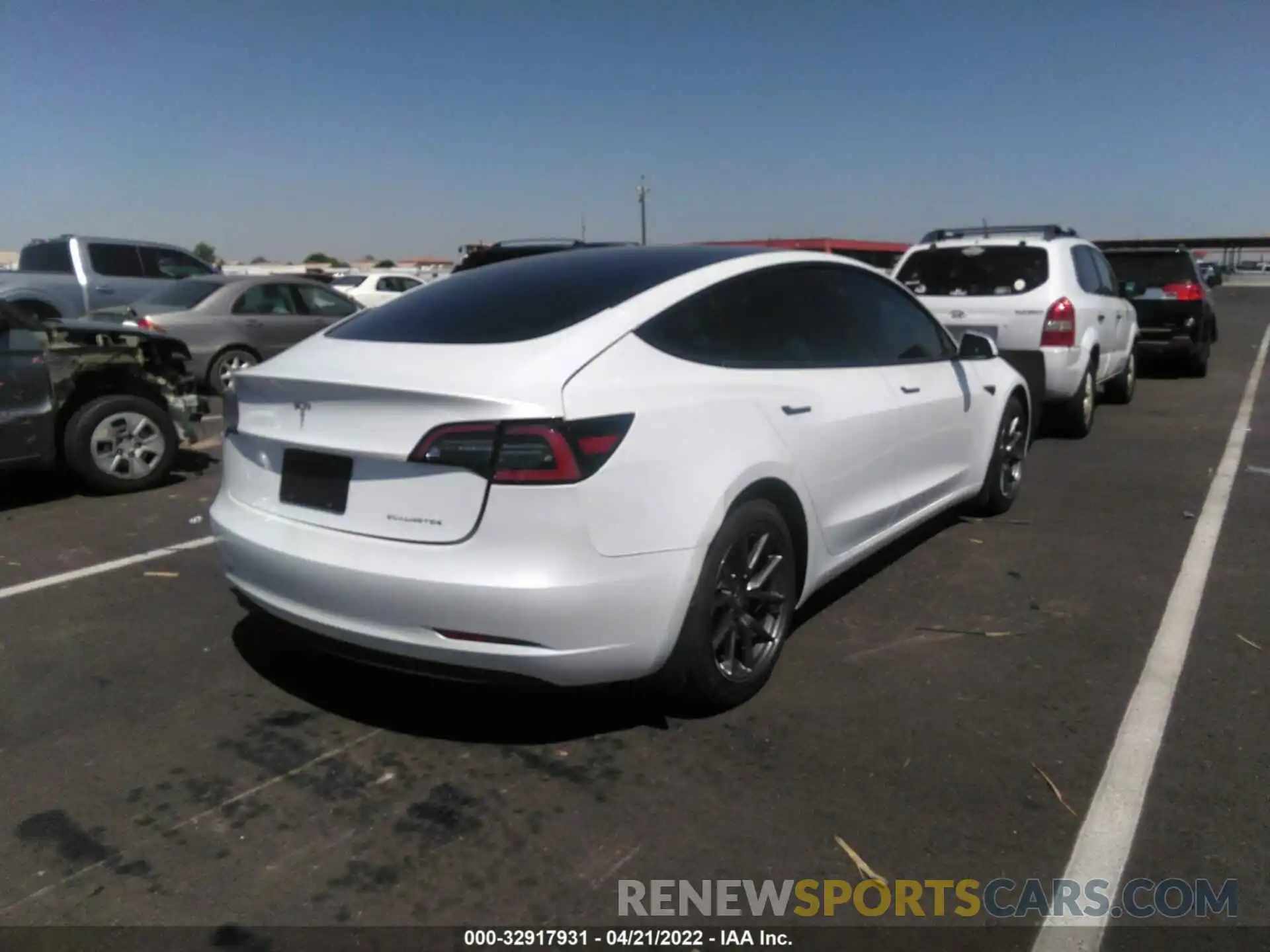 4 Photograph of a damaged car 5YJ3E1EAXMF989888 TESLA MODEL 3 2021