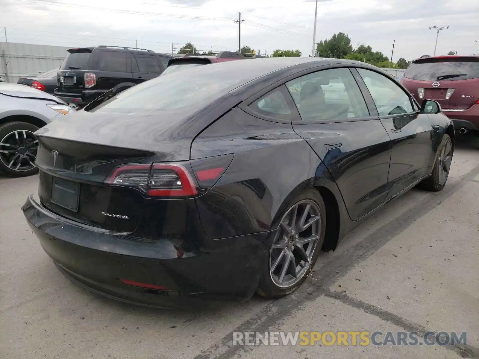 4 Photograph of a damaged car 5YJ3E1EB0MF974549 TESLA MODEL 3 2021