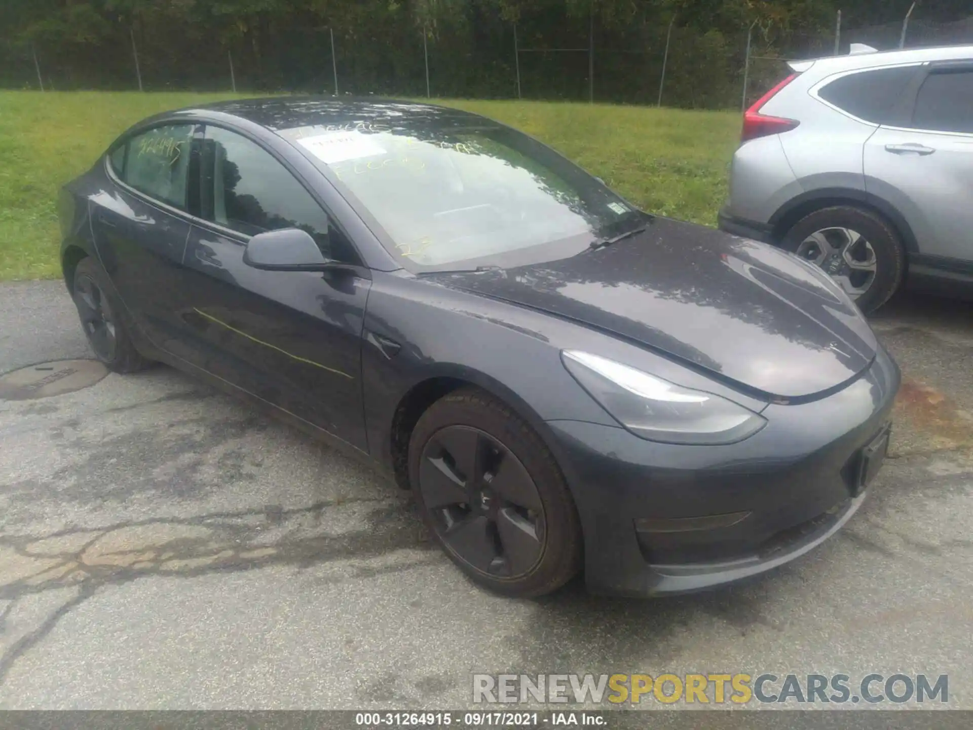 1 Photograph of a damaged car 5YJ3E1EB0MF979587 TESLA MODEL 3 2021