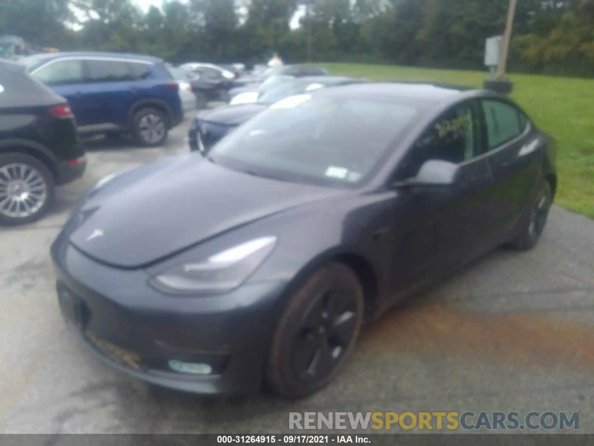 2 Photograph of a damaged car 5YJ3E1EB0MF979587 TESLA MODEL 3 2021