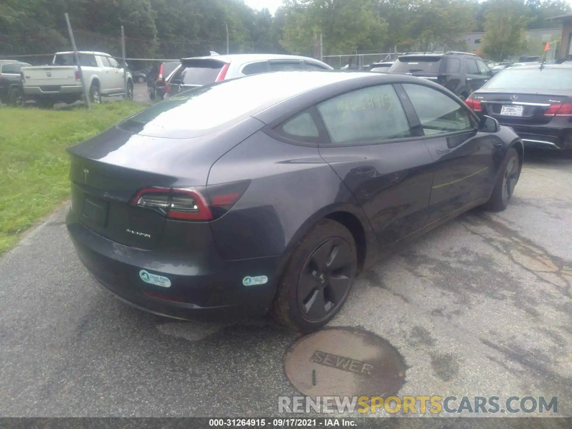 4 Photograph of a damaged car 5YJ3E1EB0MF979587 TESLA MODEL 3 2021