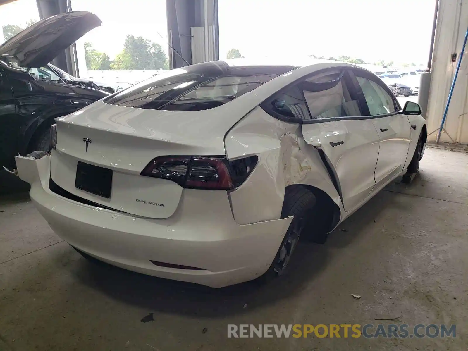 4 Photograph of a damaged car 5YJ3E1EB0MF984191 TESLA MODEL 3 2021