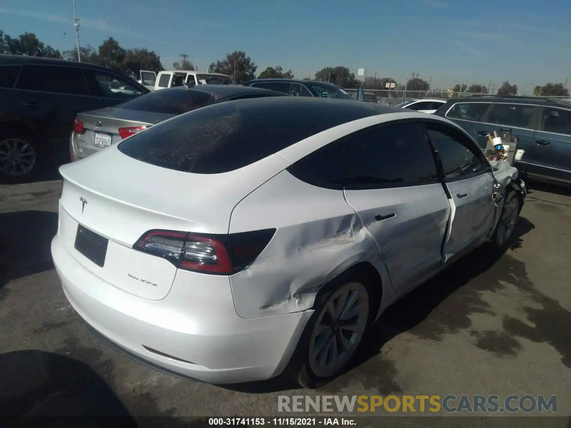 4 Photograph of a damaged car 5YJ3E1EB0MF990525 TESLA MODEL 3 2021