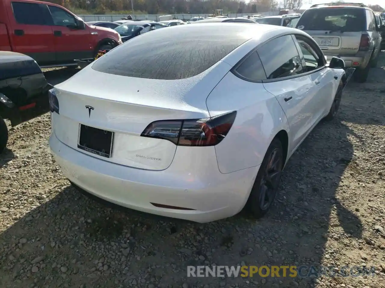 4 Photograph of a damaged car 5YJ3E1EB1MF924002 TESLA MODEL 3 2021