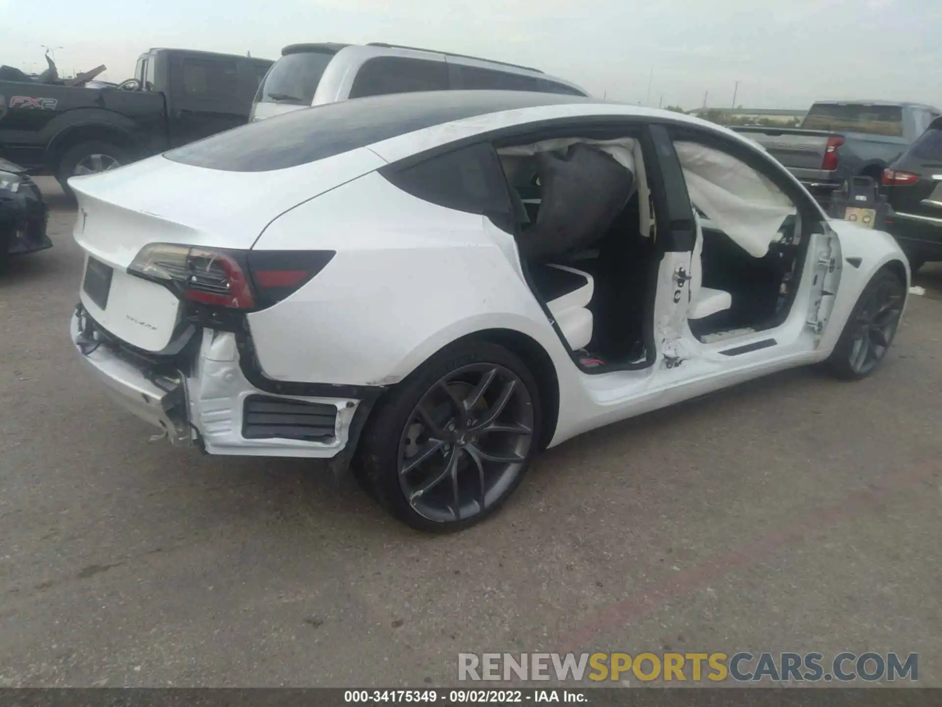 4 Photograph of a damaged car 5YJ3E1EB2MF062702 TESLA MODEL 3 2021