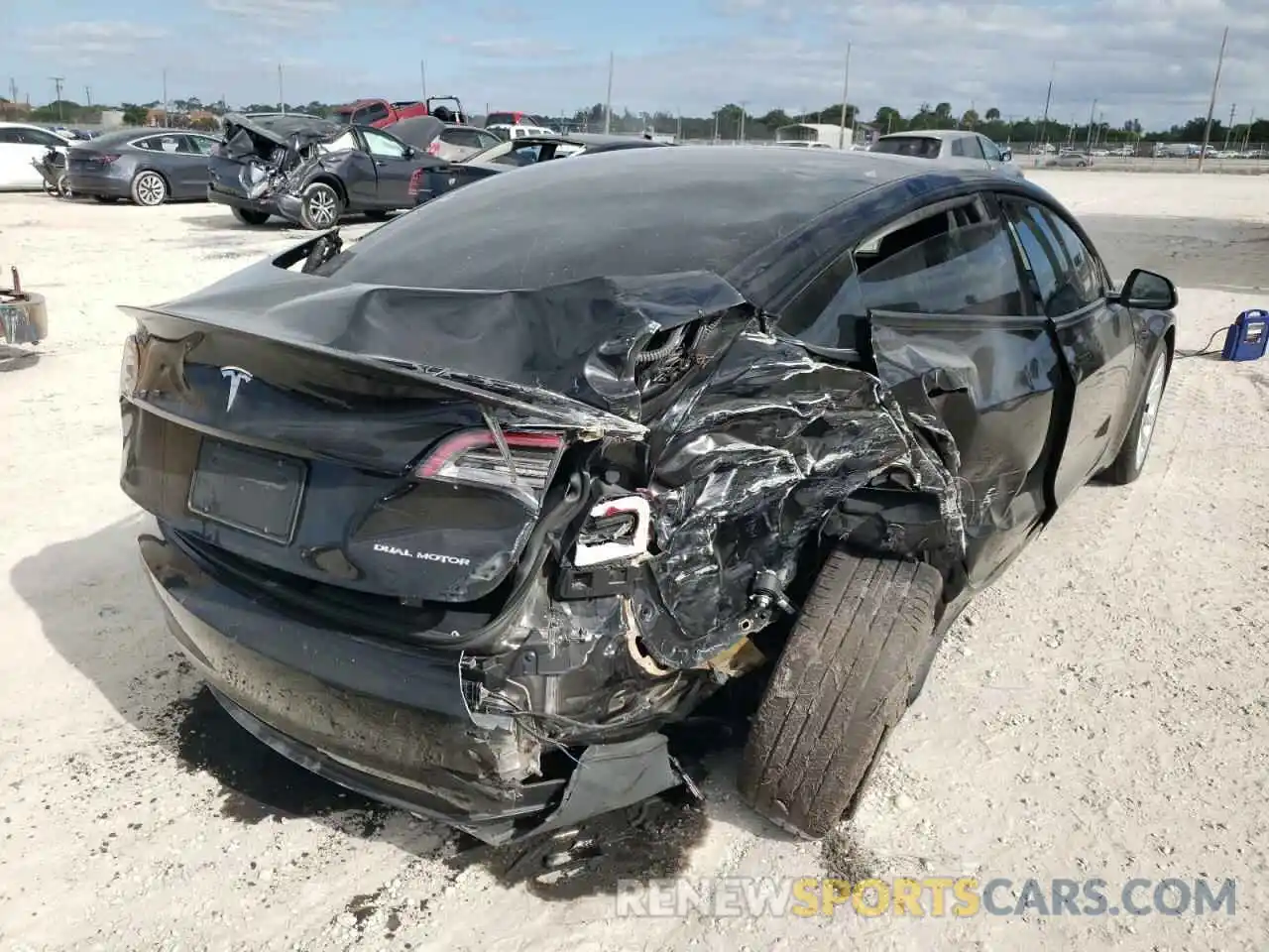 4 Photograph of a damaged car 5YJ3E1EB2MF919049 TESLA MODEL 3 2021