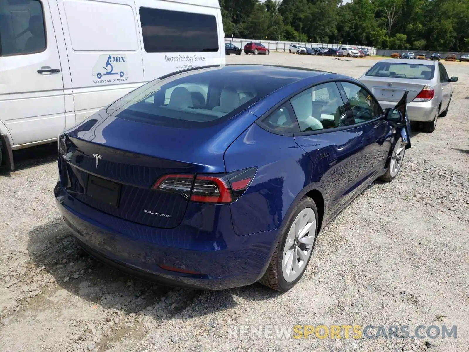 4 Photograph of a damaged car 5YJ3E1EB2MF926602 TESLA MODEL 3 2021