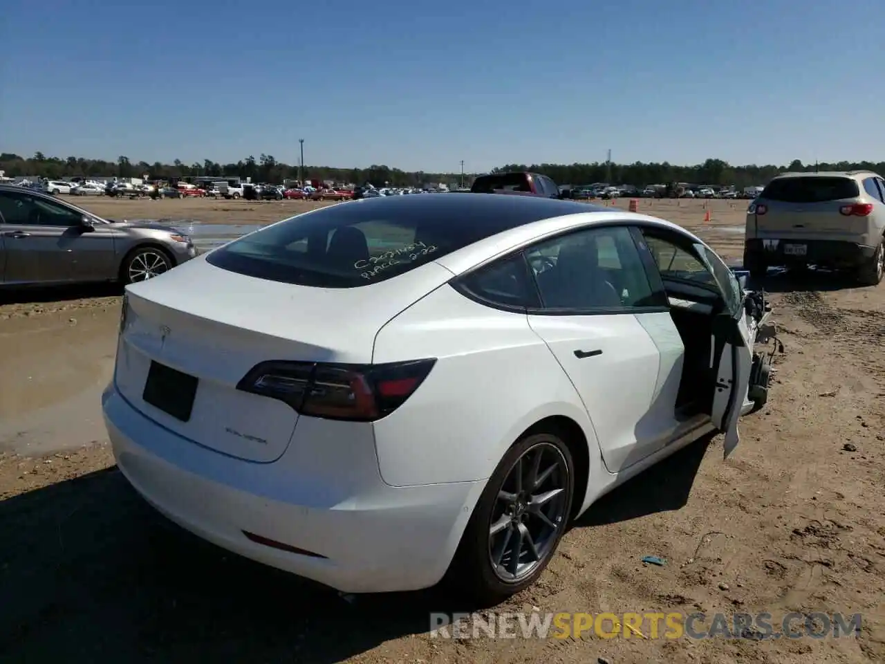 4 Photograph of a damaged car 5YJ3E1EB4MF860179 TESLA MODEL 3 2021