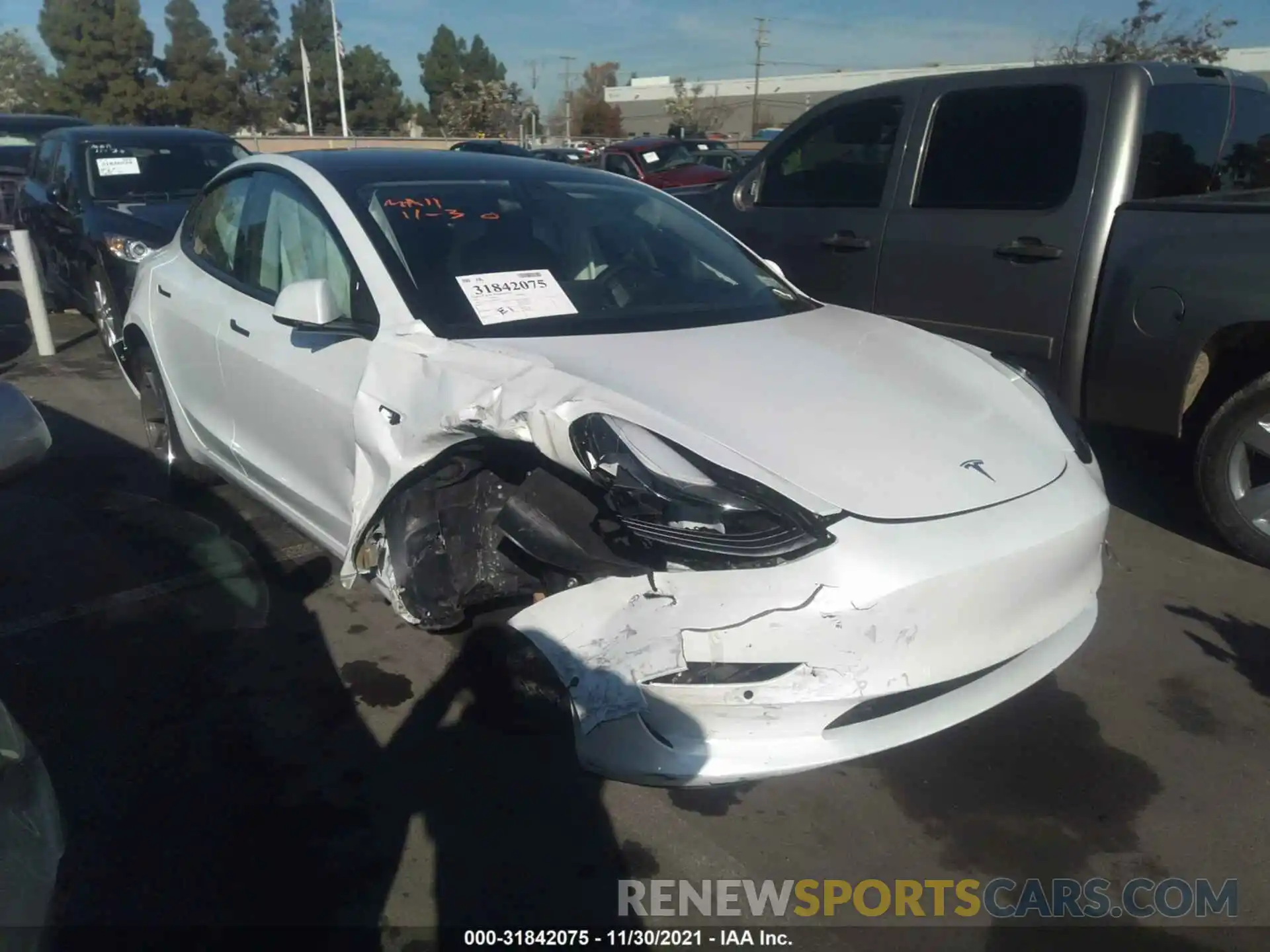 1 Photograph of a damaged car 5YJ3E1EB4MF864653 TESLA MODEL 3 2021