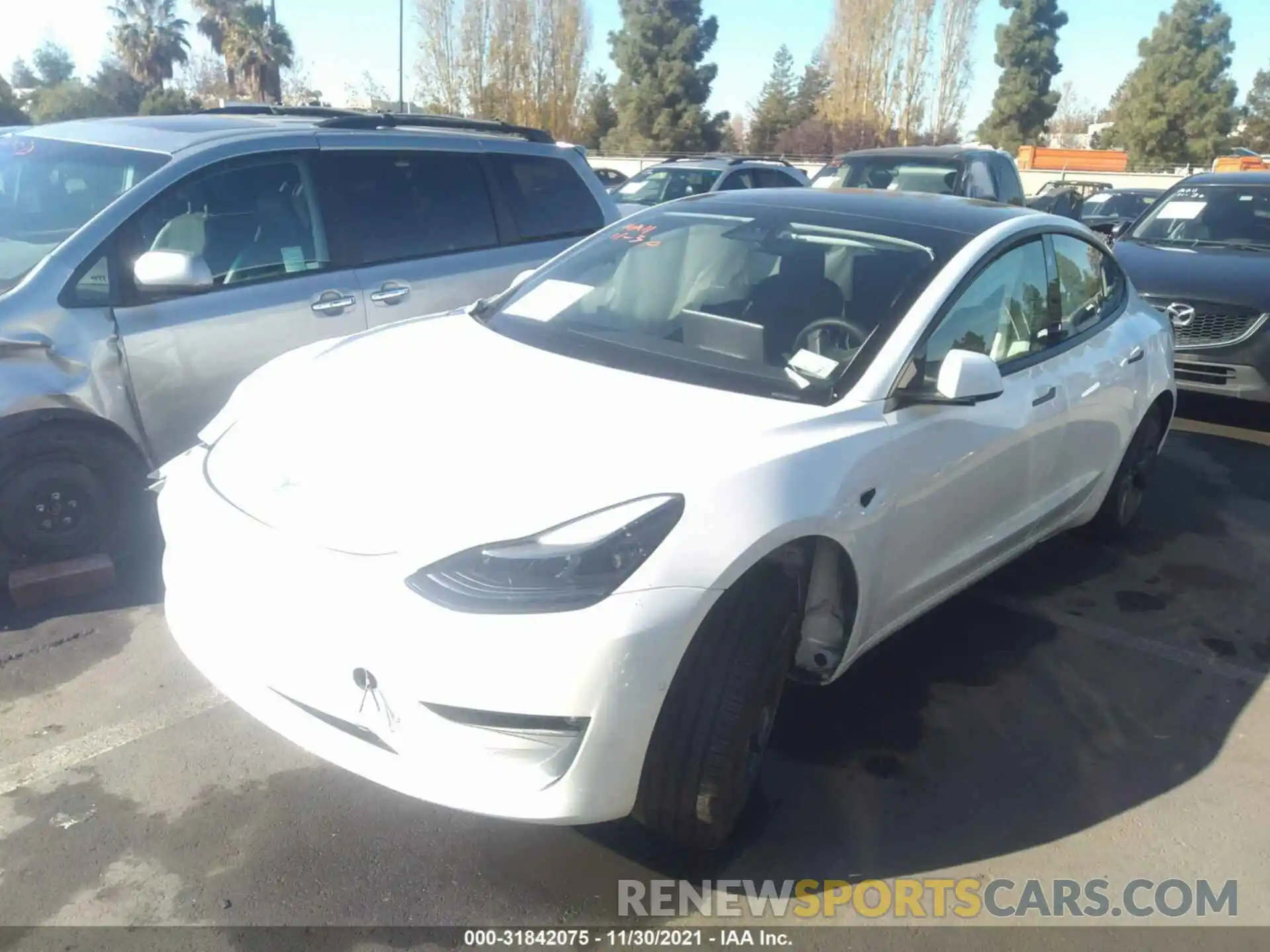 2 Photograph of a damaged car 5YJ3E1EB4MF864653 TESLA MODEL 3 2021