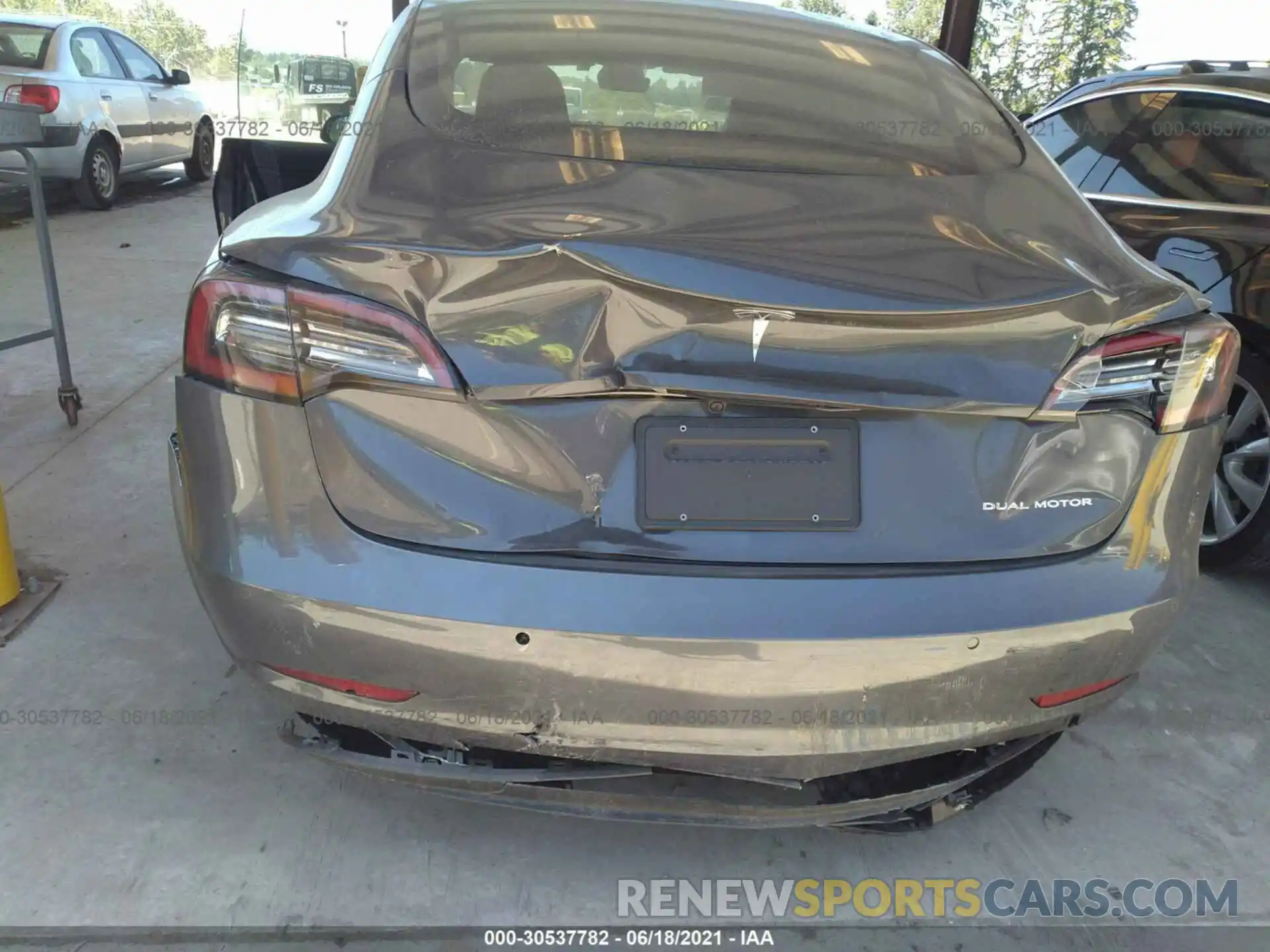 6 Photograph of a damaged car 5YJ3E1EB4MF938380 TESLA MODEL 3 2021