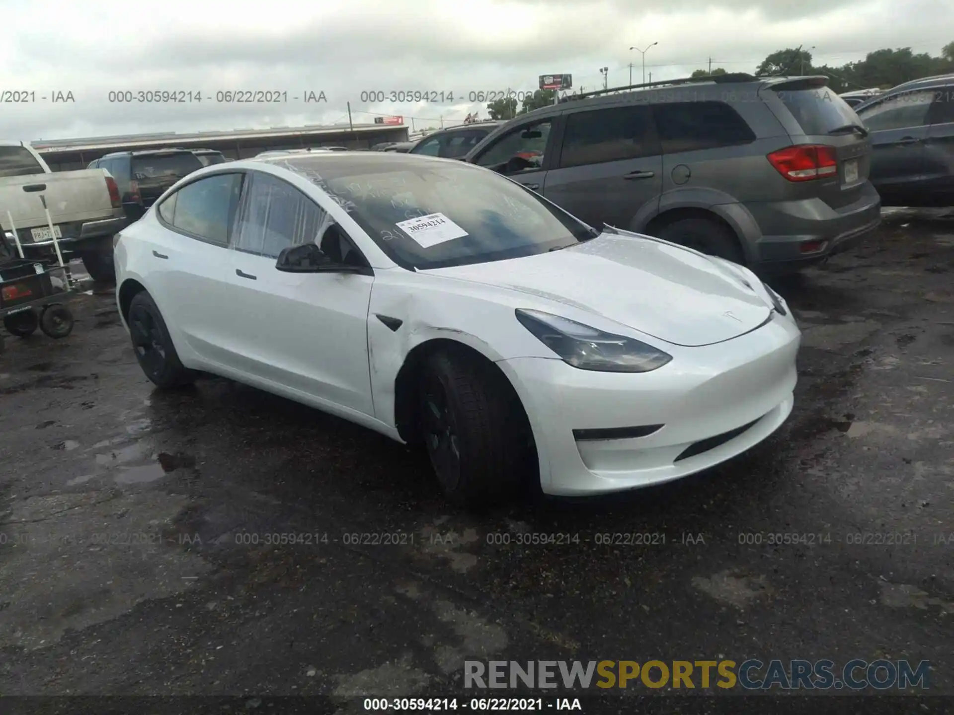 1 Photograph of a damaged car 5YJ3E1EB4MF983433 TESLA MODEL 3 2021