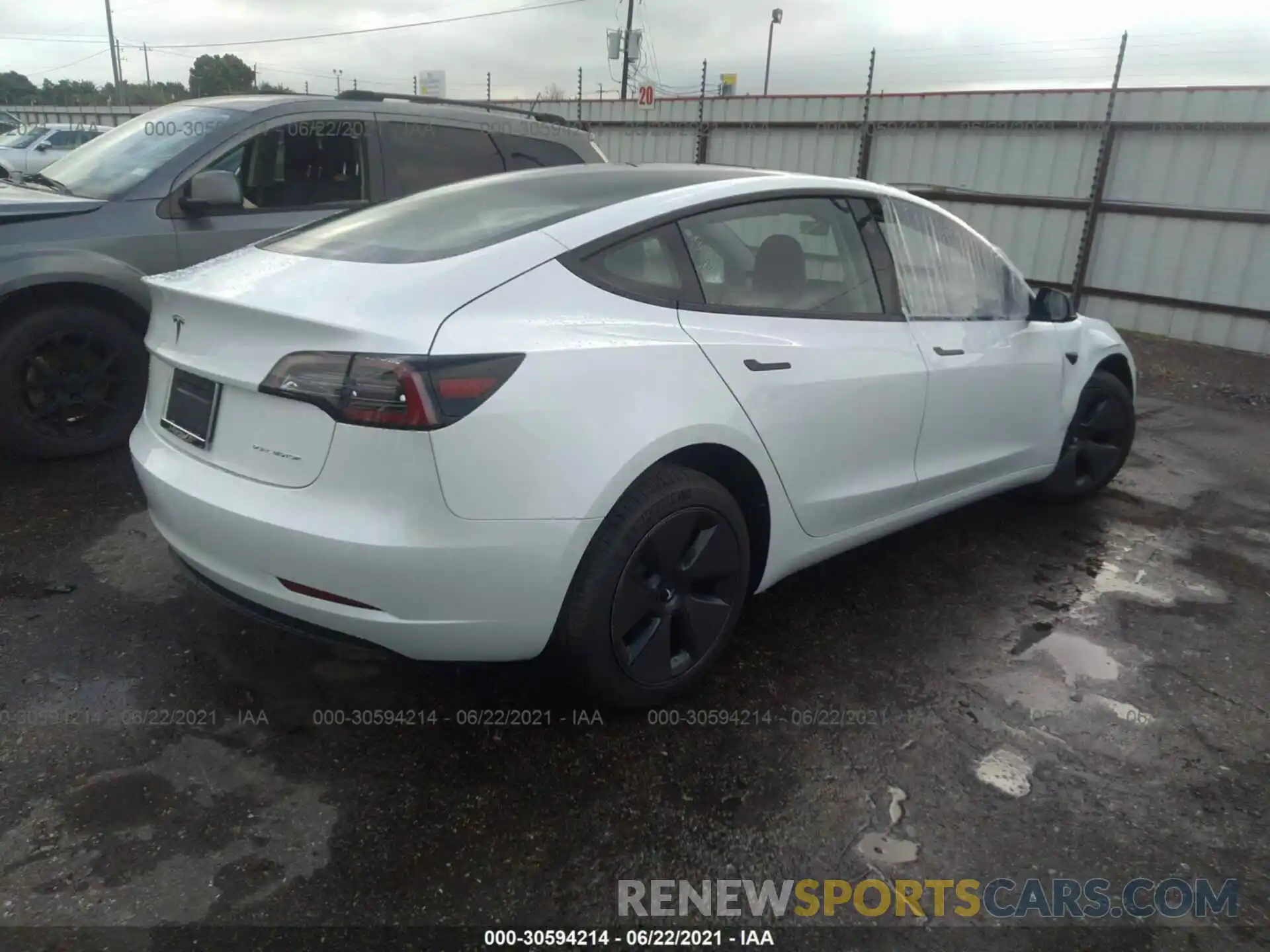 4 Photograph of a damaged car 5YJ3E1EB4MF983433 TESLA MODEL 3 2021