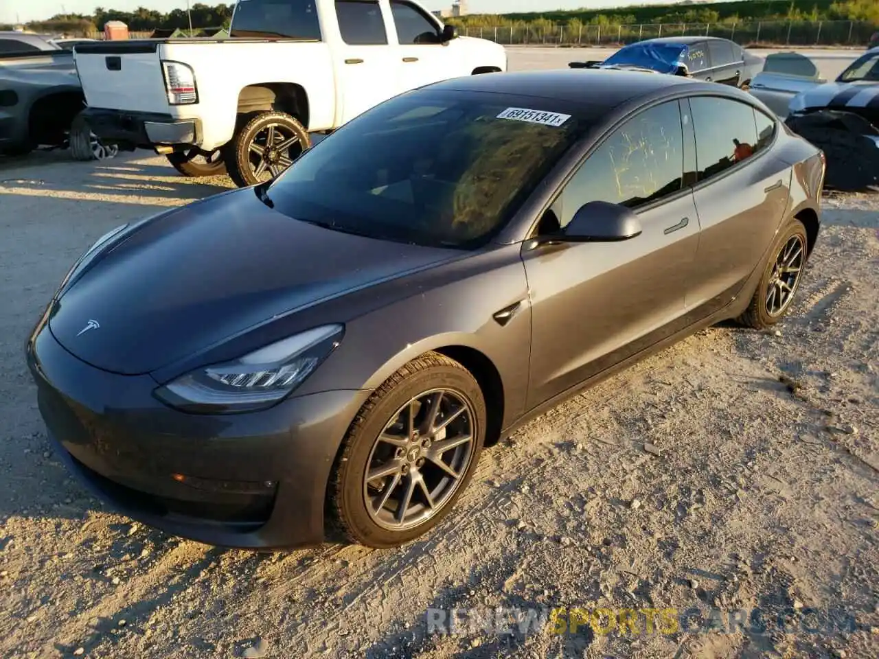 2 Photograph of a damaged car 5YJ3E1EB5MF855850 TESLA MODEL 3 2021