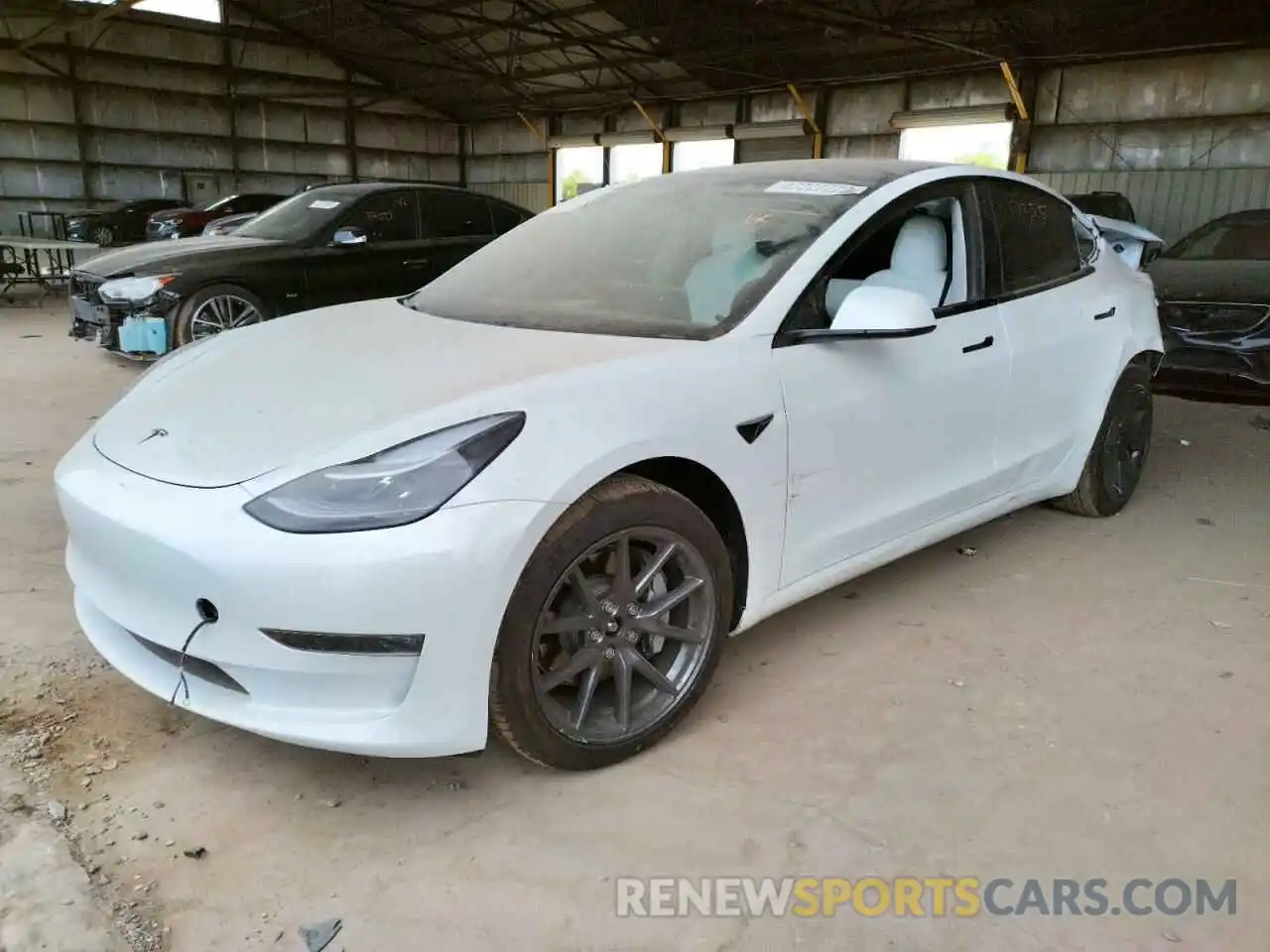 2 Photograph of a damaged car 5YJ3E1EB6MF999889 TESLA MODEL 3 2021