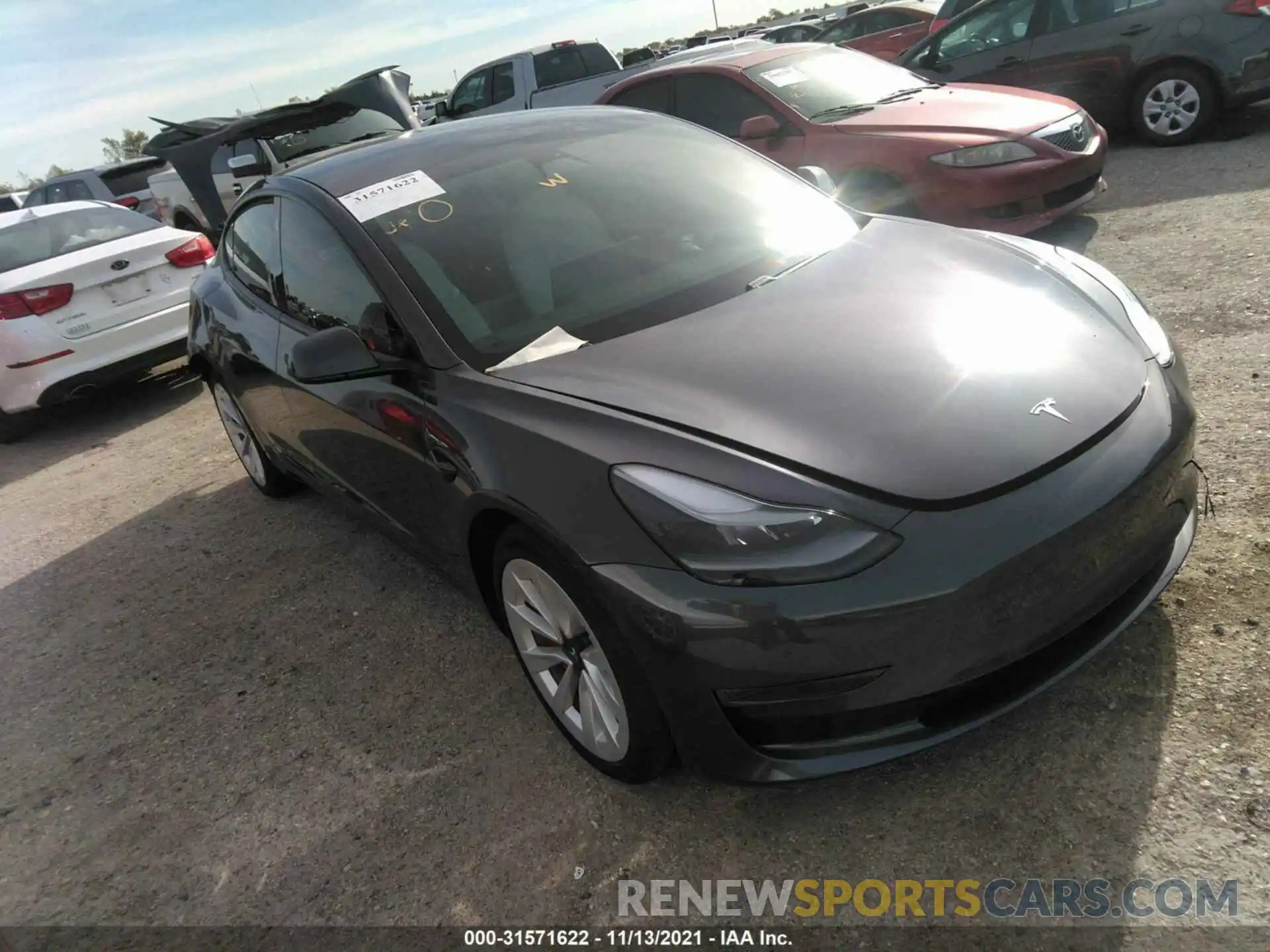 1 Photograph of a damaged car 5YJ3E1EB7MF975374 TESLA MODEL 3 2021