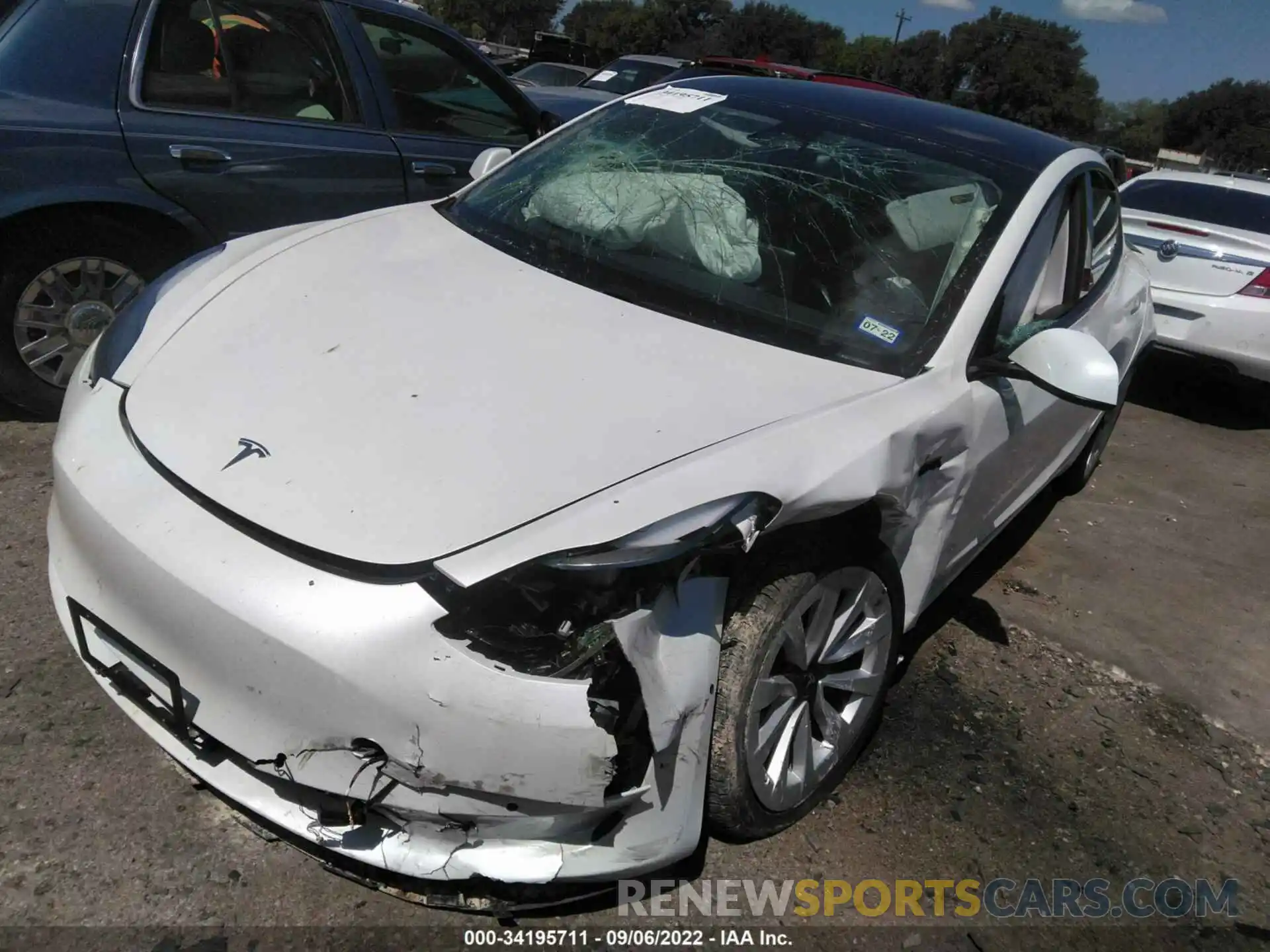 2 Photograph of a damaged car 5YJ3E1EB7MF990117 TESLA MODEL 3 2021