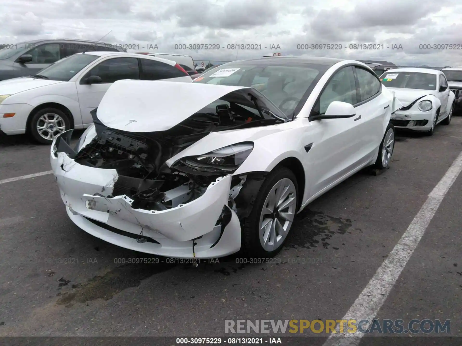 2 Photograph of a damaged car 5YJ3E1EB7MF990294 TESLA MODEL 3 2021