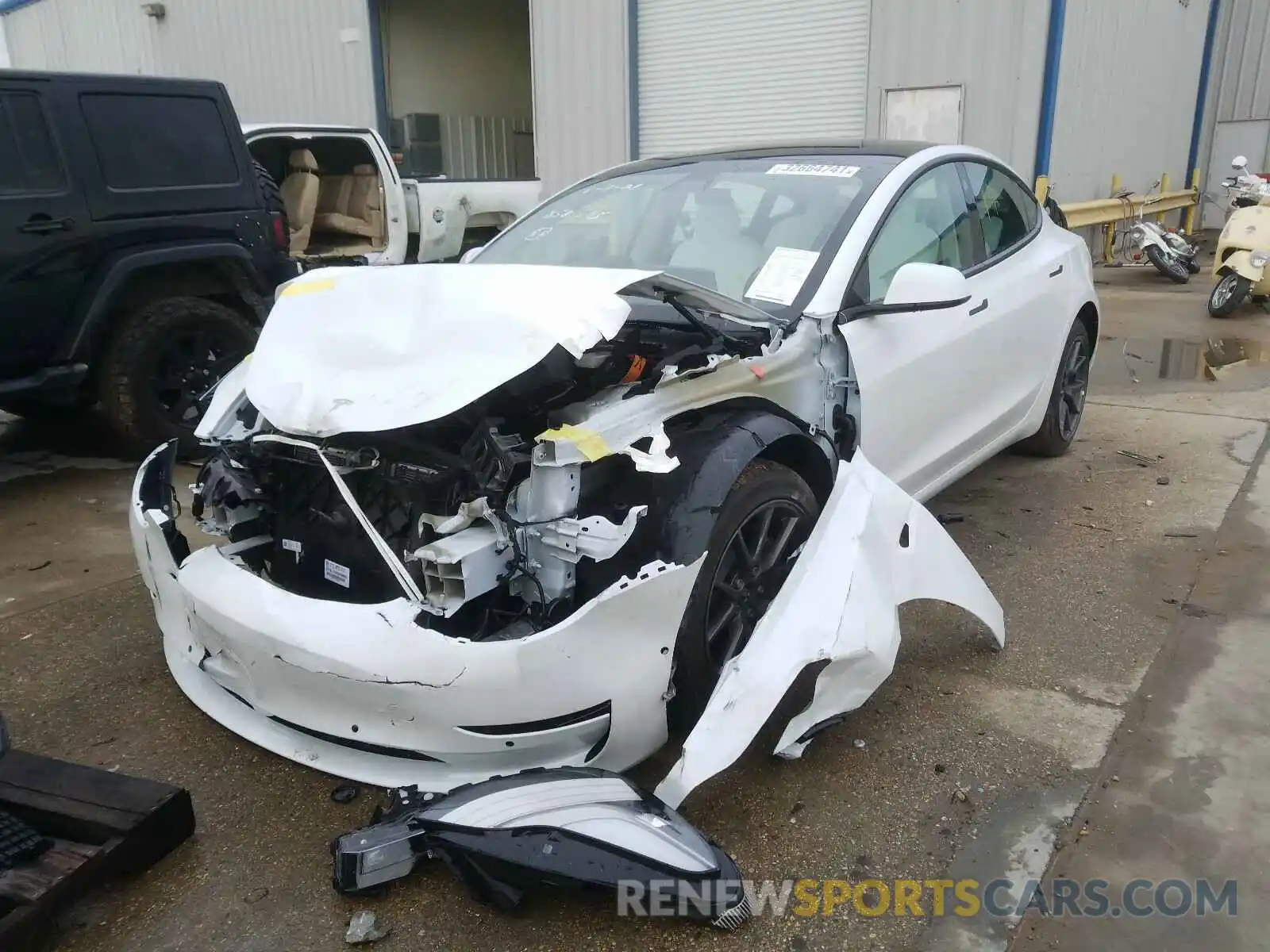 2 Photograph of a damaged car 5YJ3E1EB8MF858595 TESLA MODEL 3 2021