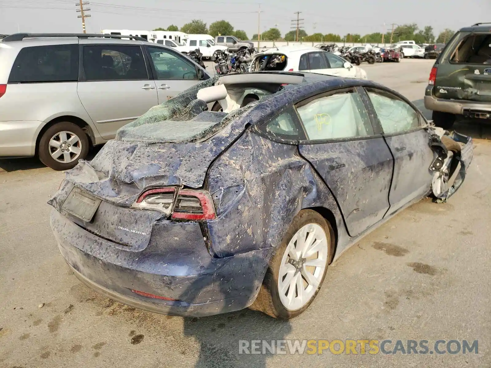 4 Photograph of a damaged car 5YJ3E1EB8MF990076 TESLA MODEL 3 2021