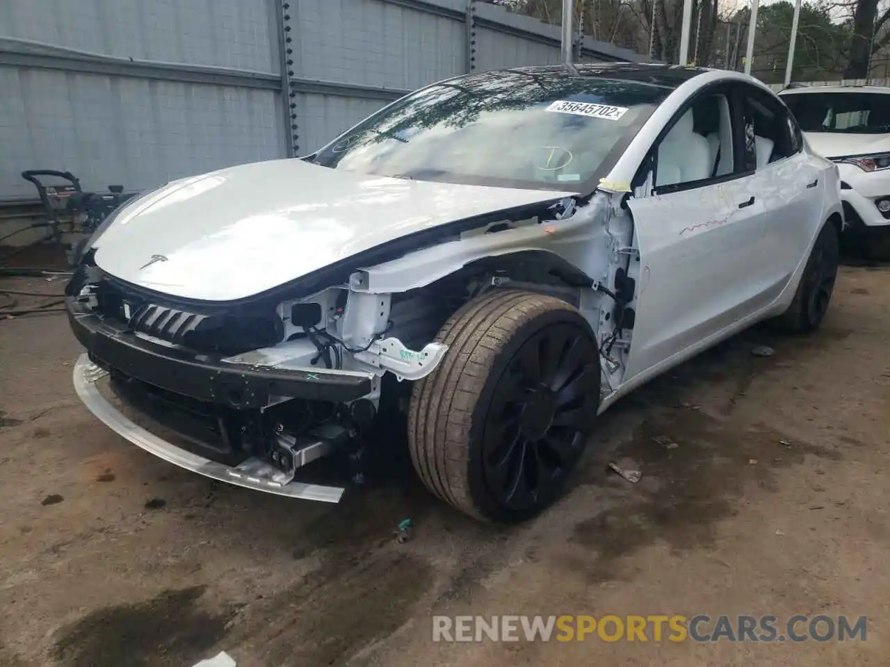 2 Photograph of a damaged car 5YJ3E1EC2MF980927 TESLA MODEL 3 2021