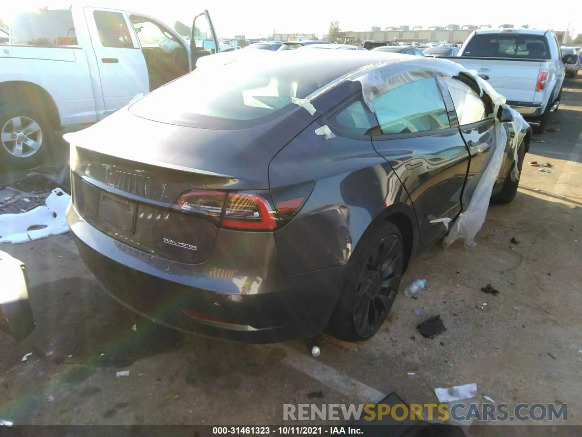 4 Photograph of a damaged car 5YJ3E1EC4MF990567 TESLA MODEL 3 2021