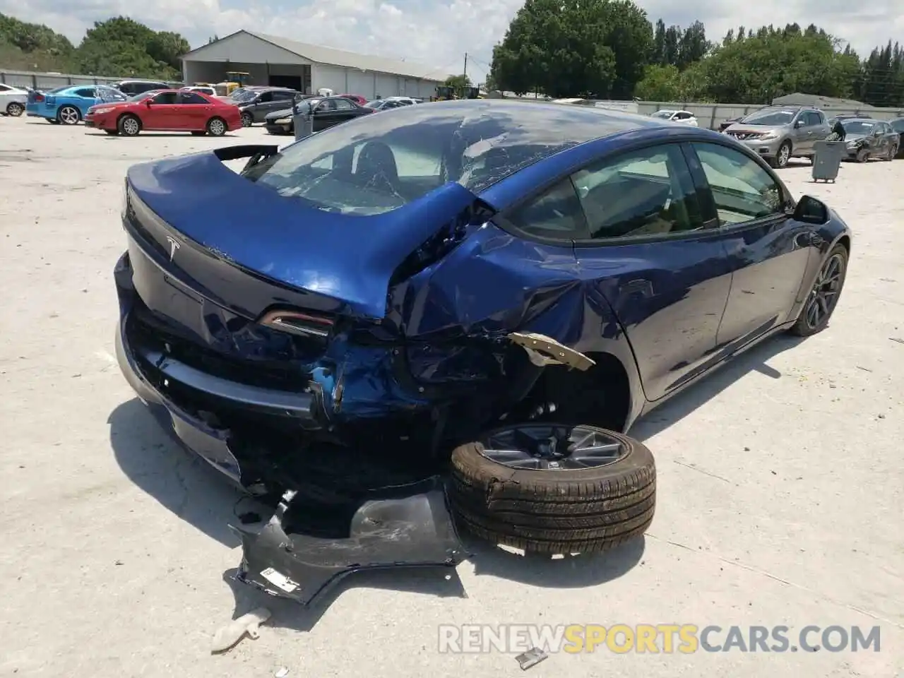 4 Photograph of a damaged car 5YJ3E1EA0NF189974 TESLA MODEL 3 2022