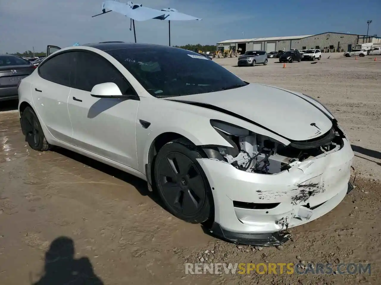 4 Photograph of a damaged car 5YJ3E1EA0NF328985 TESLA MODEL 3 2022