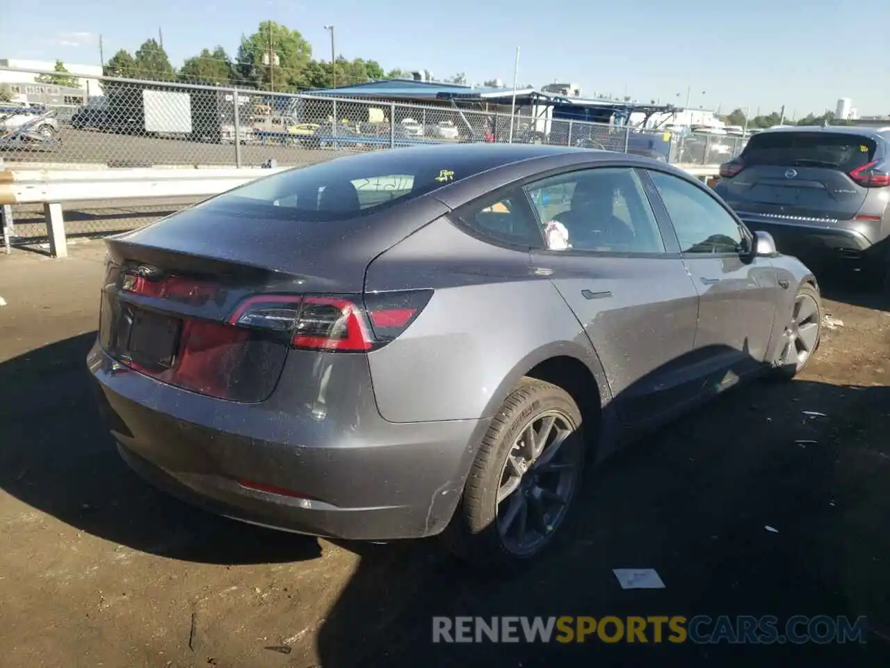 4 Photograph of a damaged car 5YJ3E1EA1NF189997 TESLA MODEL 3 2022