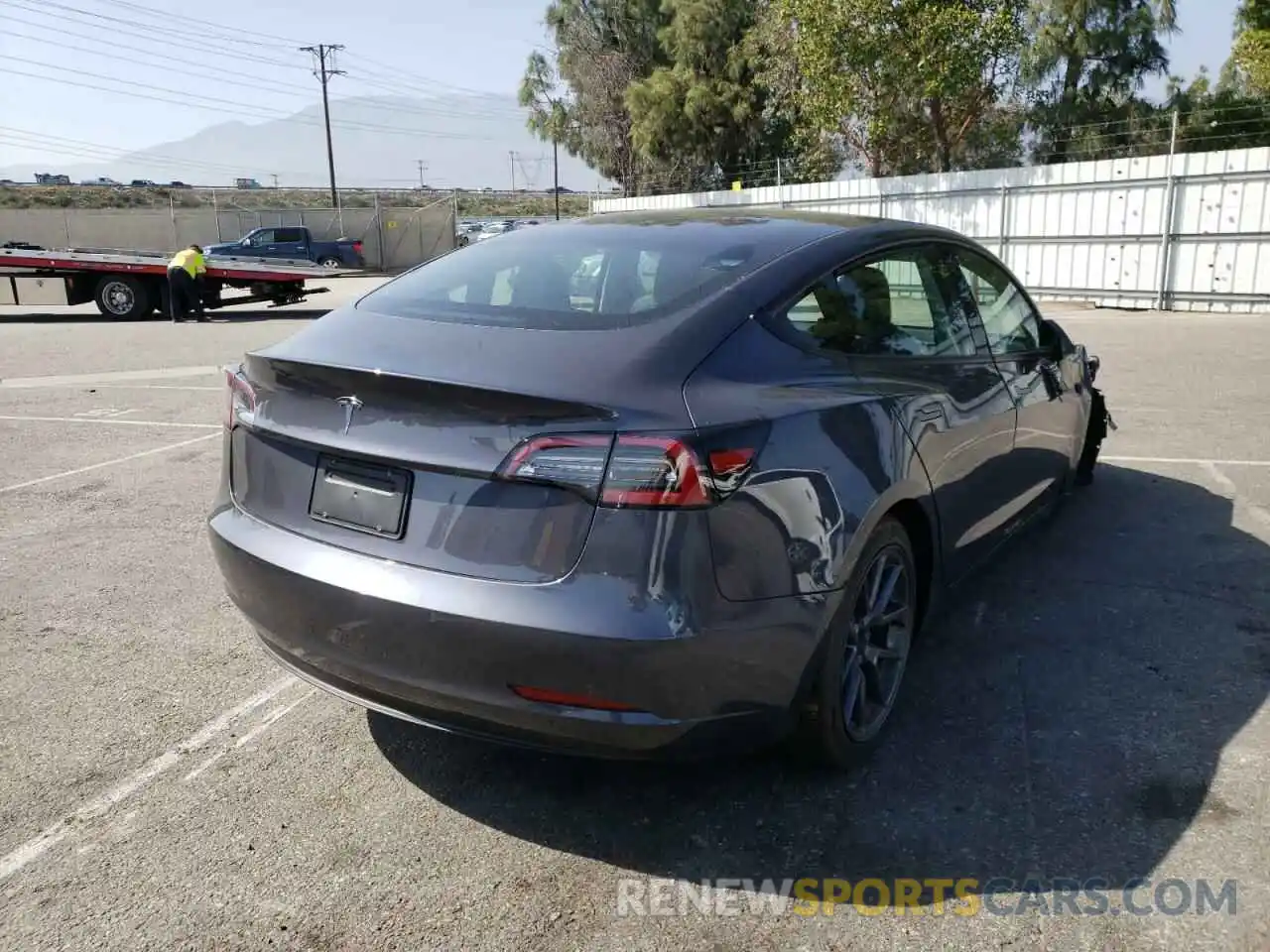 4 Photograph of a damaged car 5YJ3E1EA6NF125499 TESLA MODEL 3 2022