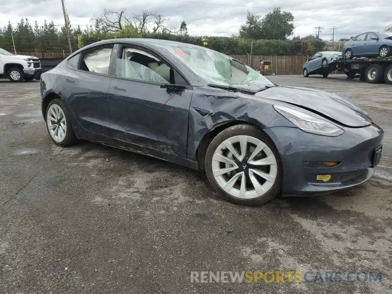 4 Photograph of a damaged car 5YJ3E1EA6NF242970 TESLA MODEL 3 2022