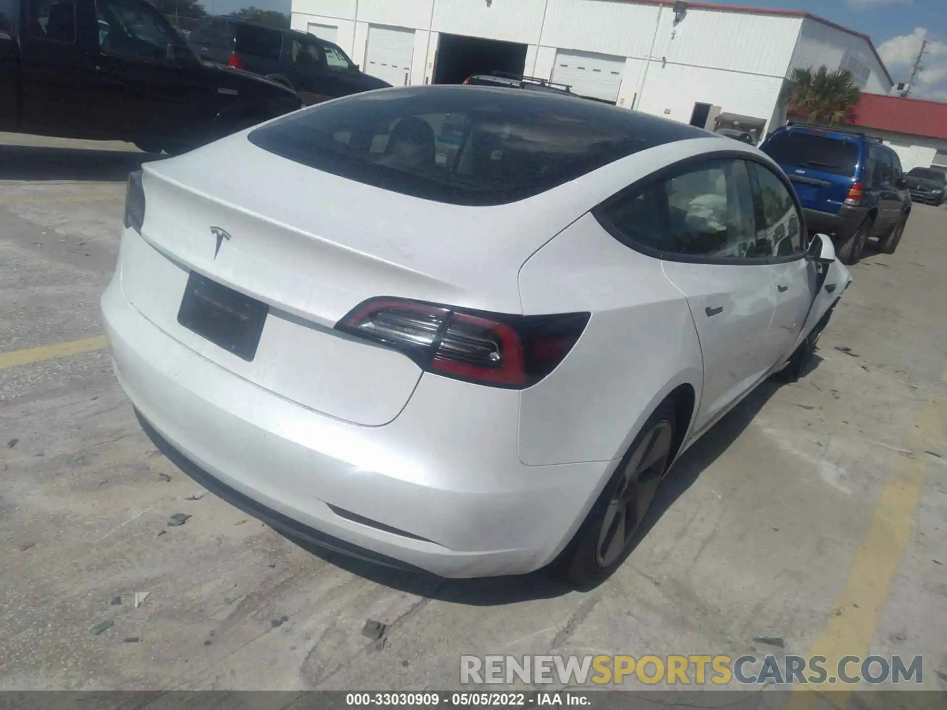 4 Photograph of a damaged car 5YJ3E1EA7NF103771 TESLA MODEL 3 2022