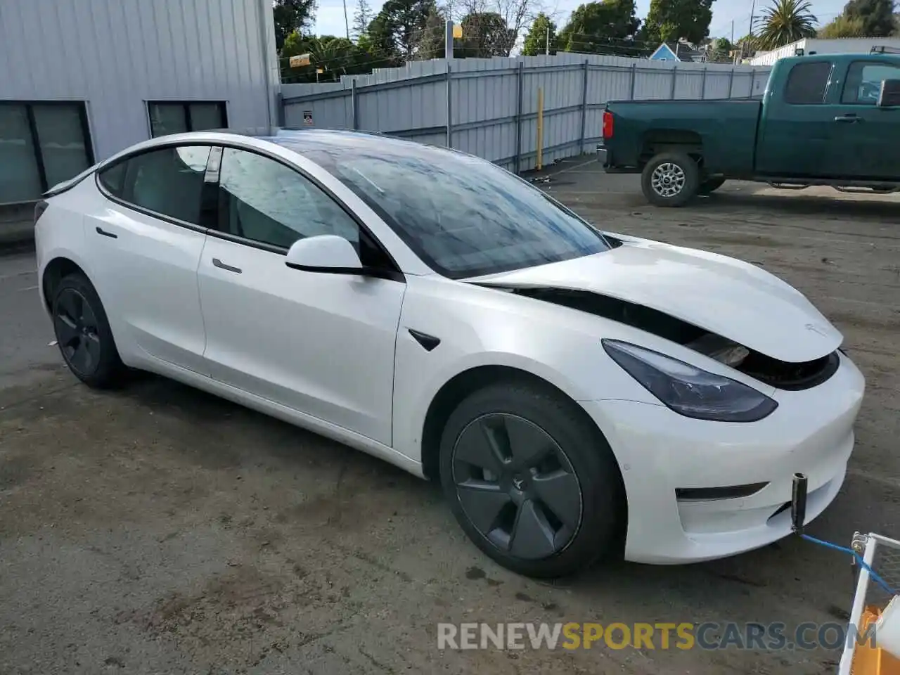 4 Photograph of a damaged car 5YJ3E1EA9NF106803 TESLA MODEL 3 2022