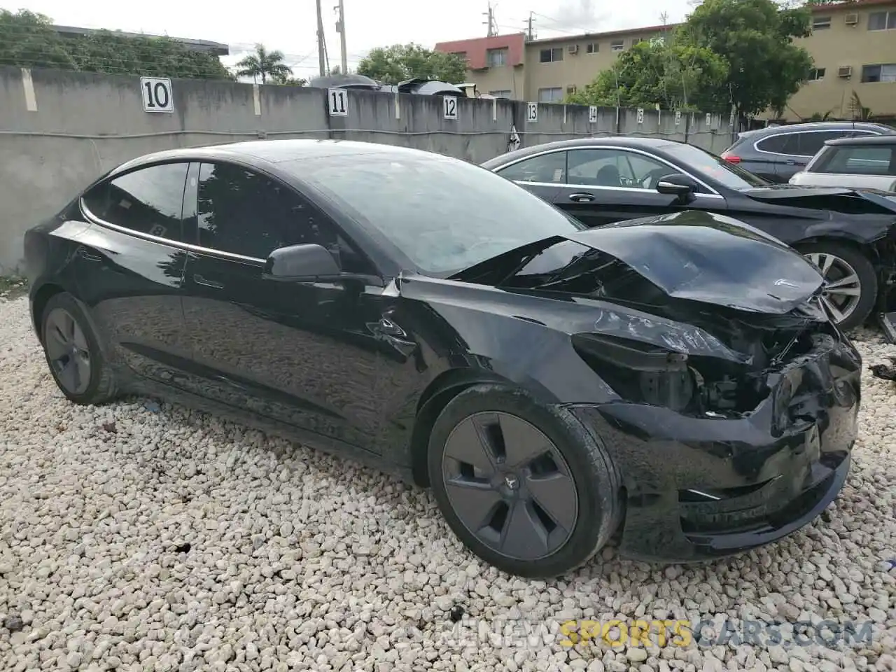 4 Photograph of a damaged car 5YJ3E1EA9NF313062 TESLA MODEL 3 2022