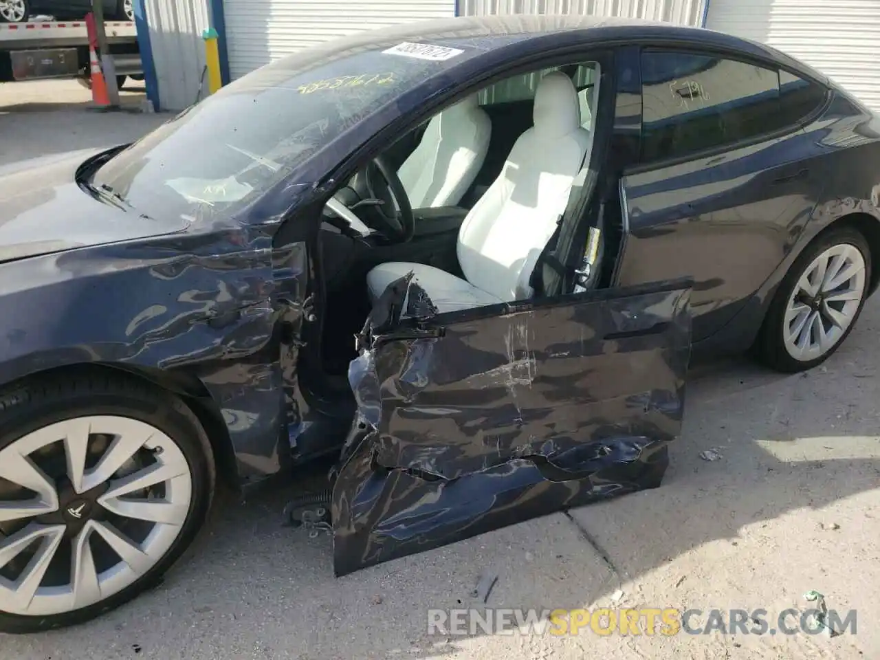 9 Photograph of a damaged car 5YJ3E1EAXNF155301 TESLA MODEL 3 2022