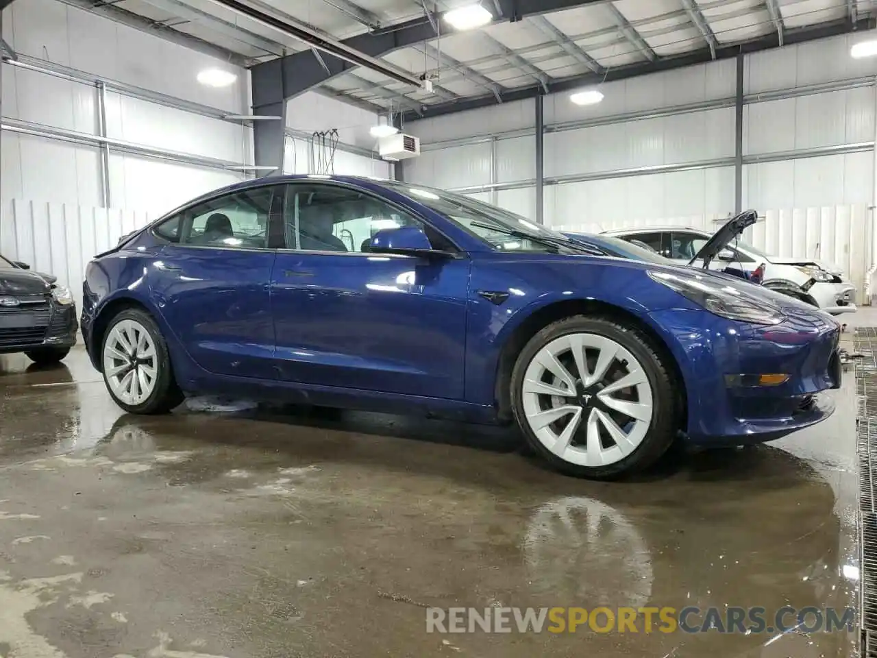 4 Photograph of a damaged car 5YJ3E1EAXNF192087 TESLA MODEL 3 2022