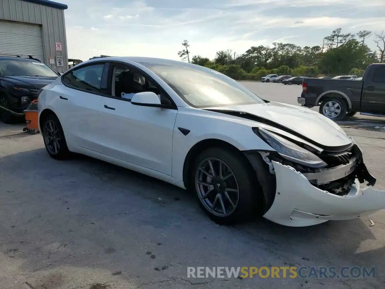 4 Photograph of a damaged car 5YJ3E1EB1NF261726 TESLA MODEL 3 2022