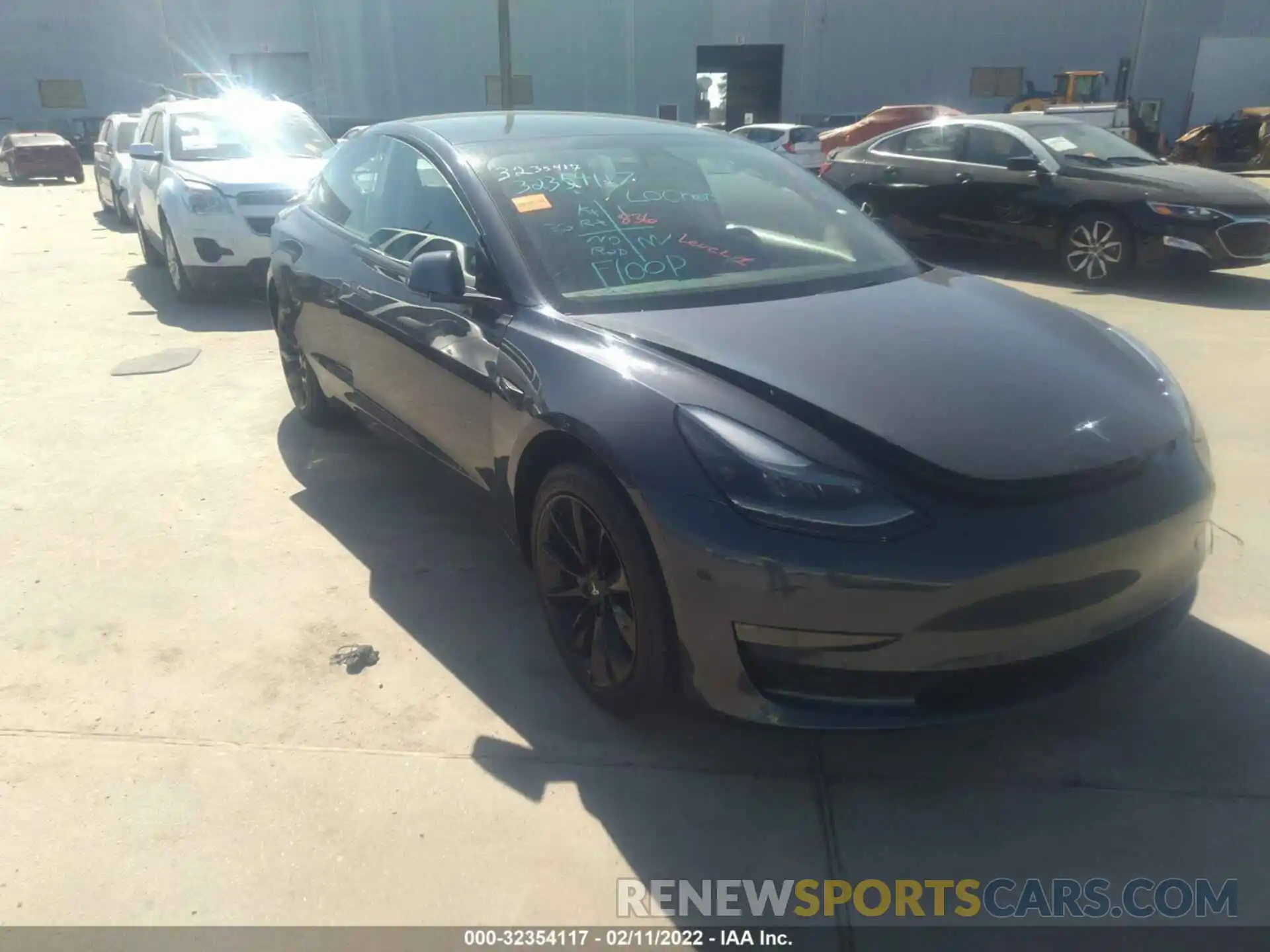 1 Photograph of a damaged car 5YJ3E1EB5NF128693 TESLA MODEL 3 2022