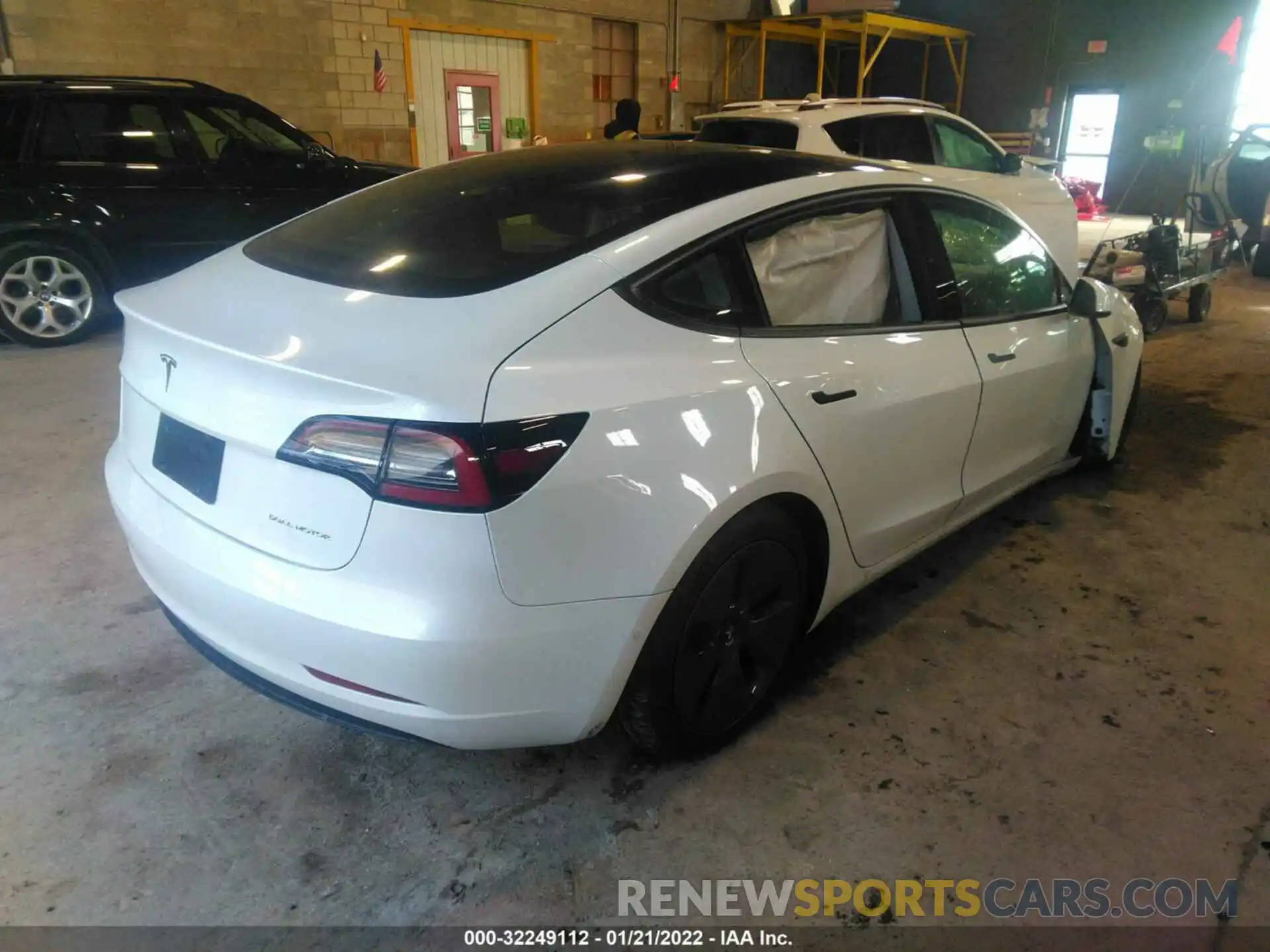 4 Photograph of a damaged car 5YJ3E1EB6NF112390 TESLA MODEL 3 2022