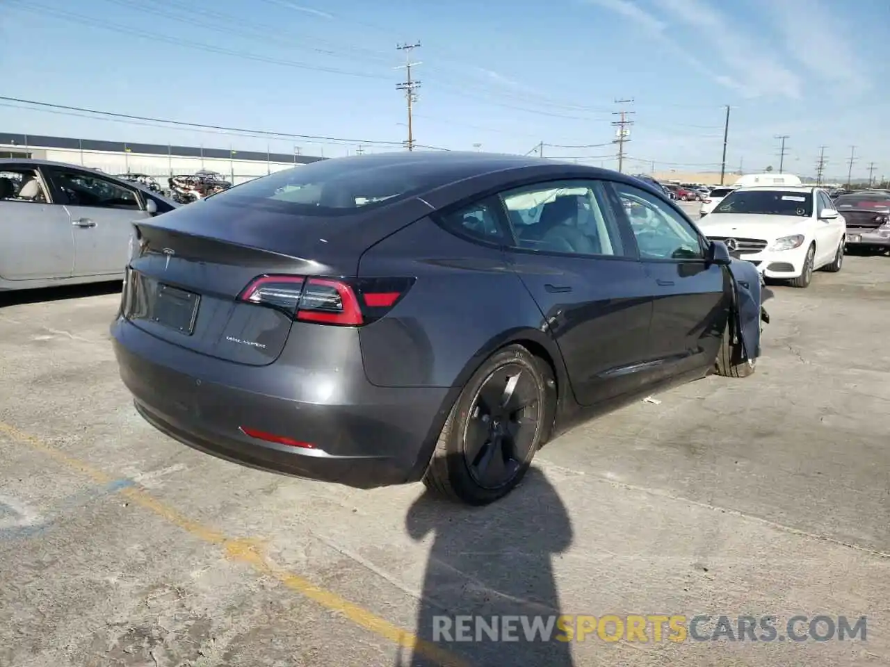 4 Photograph of a damaged car 5YJ3E1EB7NF197773 TESLA MODEL 3 2022